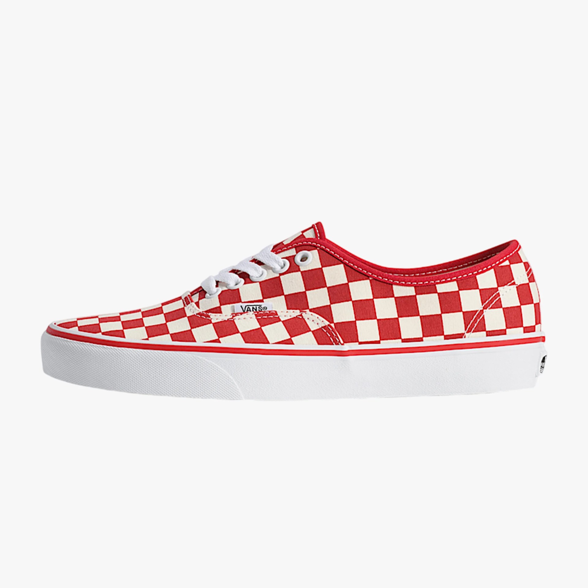 Low-top Vans sneaker with red and white checkerboard pattern and white rubber sole.