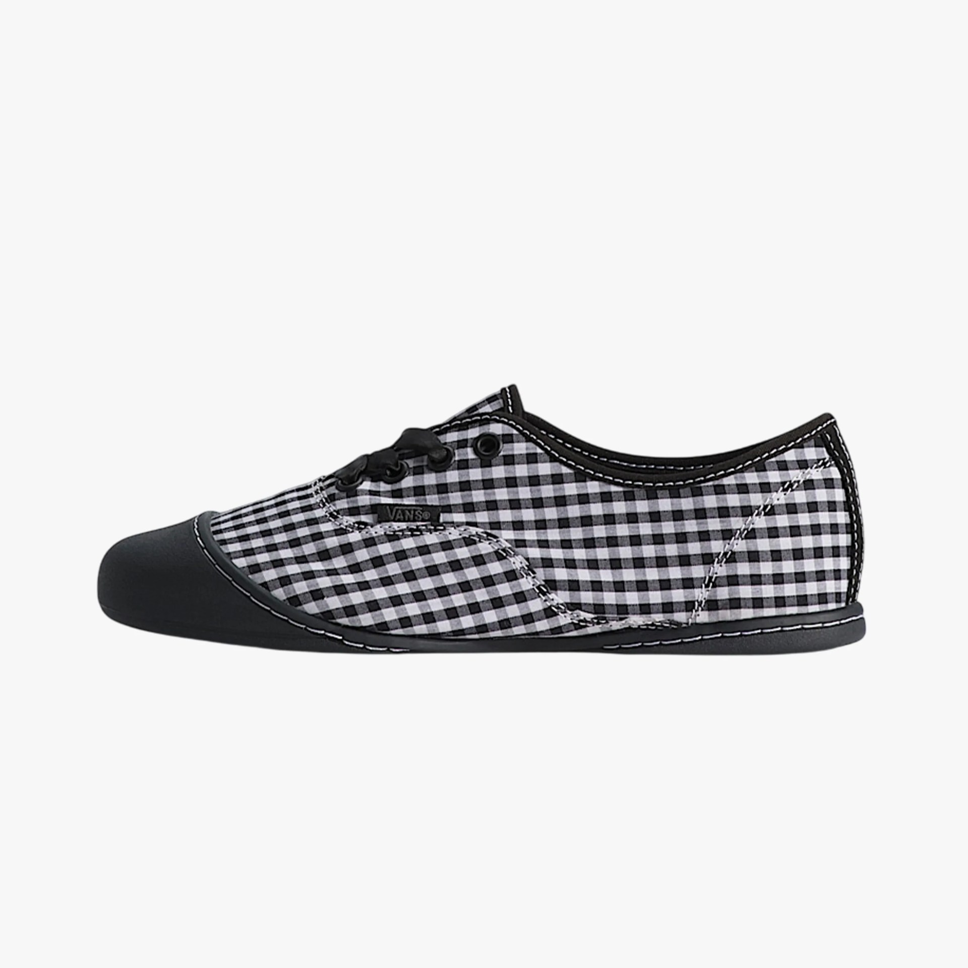 Black and white gingham Vans sneaker with black toe cap and black laces.