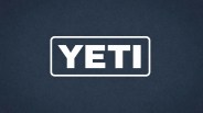 White YETI logo inside a rounded rectangle on a dark blue textured background.