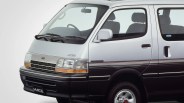 Silver and black Toyota Hiace van with 4WD badge and "Super Custom" trim, shown from front side.