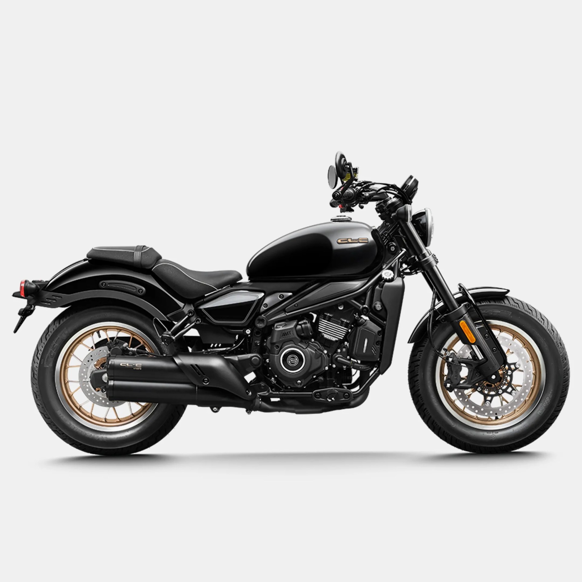 Black cruiser motorcycle with gold-spoked wheels and a low, sleek profile on a white background.