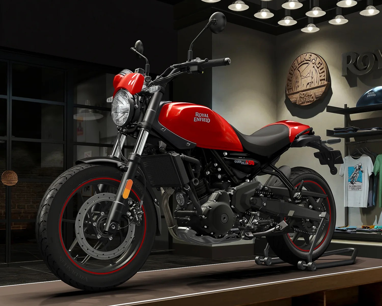 Red Royal Enfield motorcycle with black frame and red-rimmed tires displayed indoors on a stand.