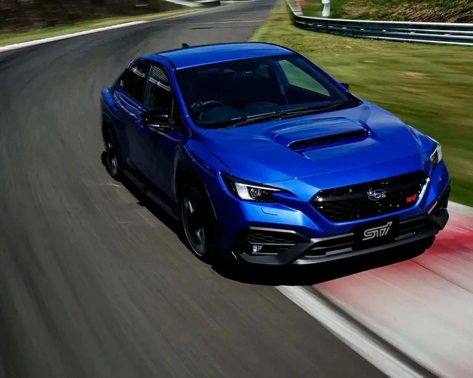 Blue Subaru WRX STI sedan cornering on a racetrack with red and white curbs.