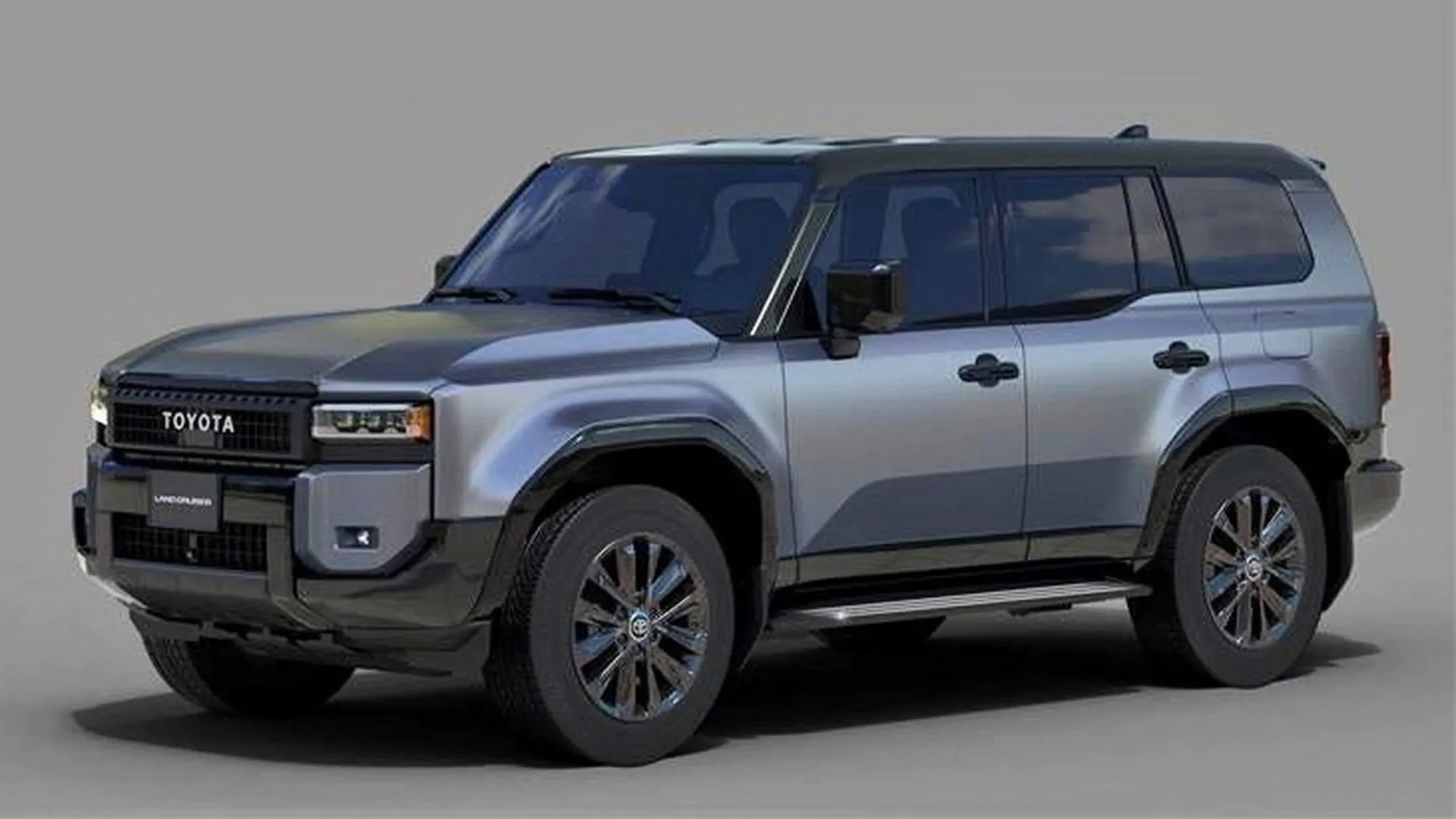 Silver Toyota Land Cruiser SUV with black roof and tinted windows on a gray background.