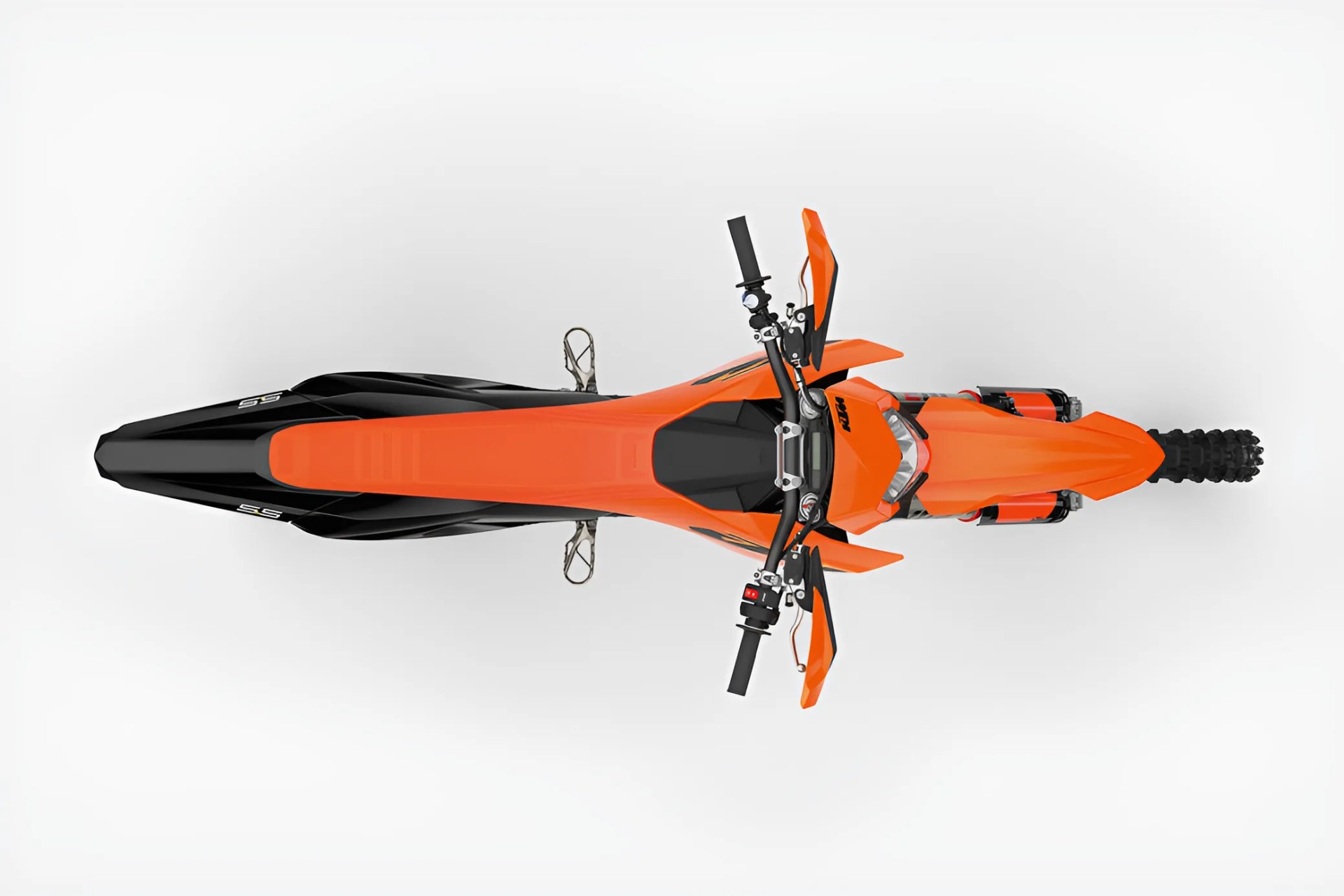 Top view of an orange and black KTM dirt bike with knobby rear tire and handguards on handlebars.