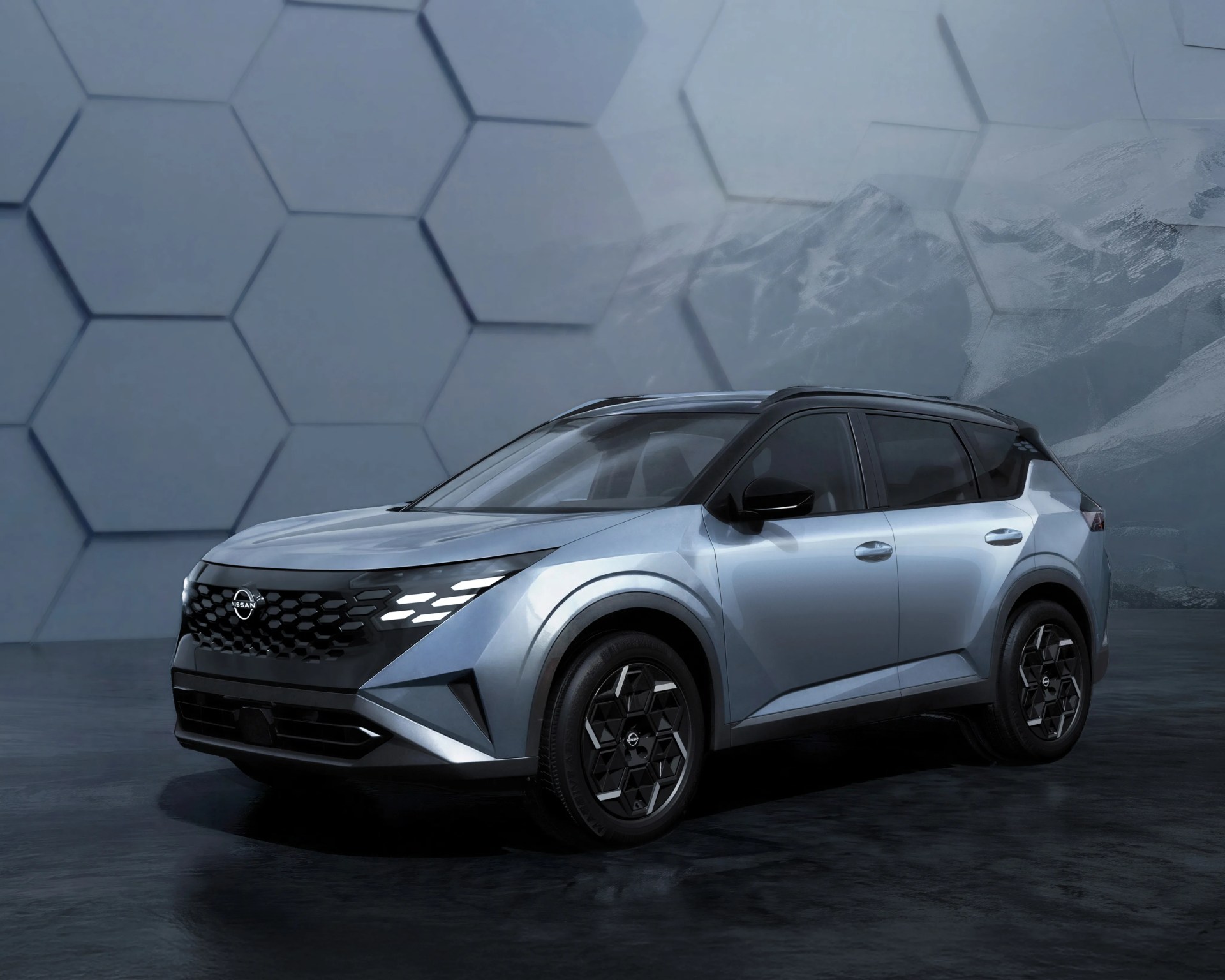 Silver and black Nissan SUV with hexagonal grille and geometric wheel design in a futuristic setting.