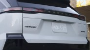 Rear view of a white Subaru Getaway vehicle with black trim and a license plate reading QHB 519.