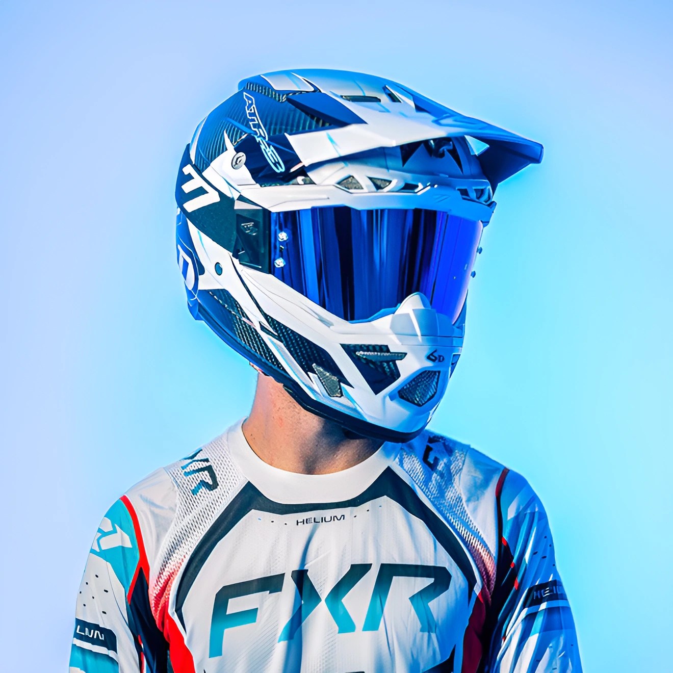Person wearing a blue and white motocross helmet with blue reflective visor and a white FXR racing jersey.