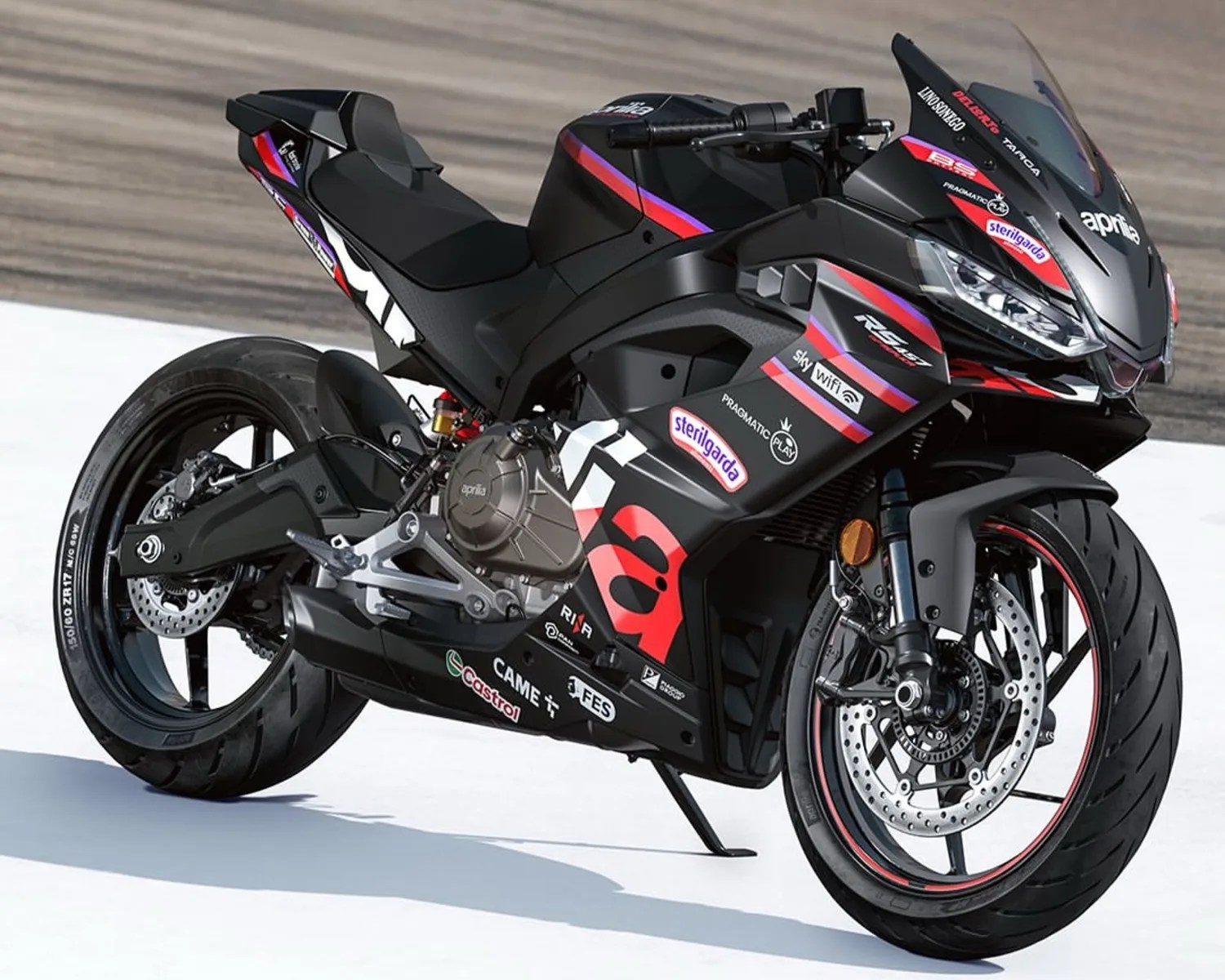 Black Aprilia sport motorcycle with red and purple racing decals on a track surface.
