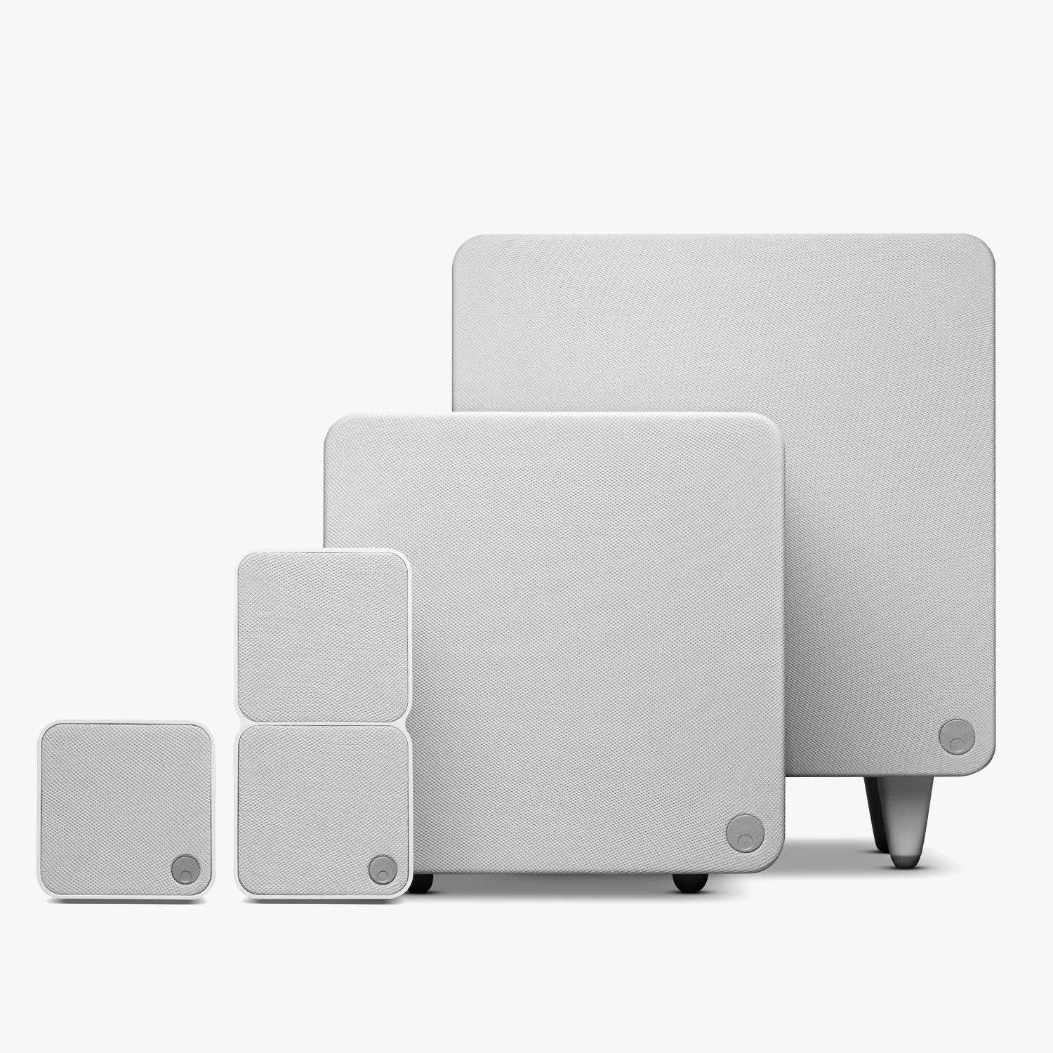 Set of five white square speakers with rounded corners and fabric covers, varying in size and arranged in a row.