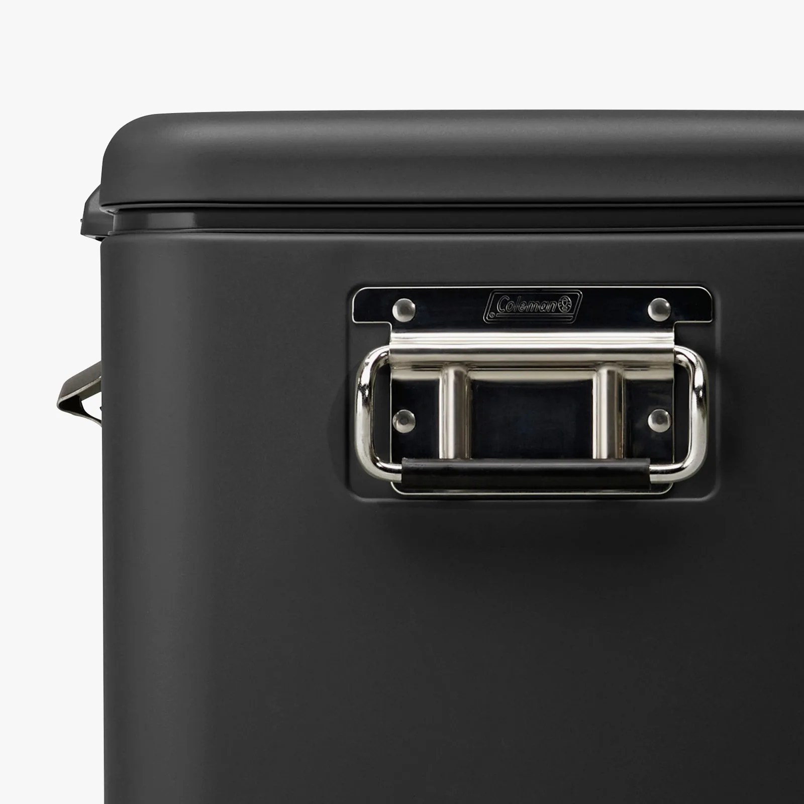 Black Coleman cooler with a silver metal handle on the side.