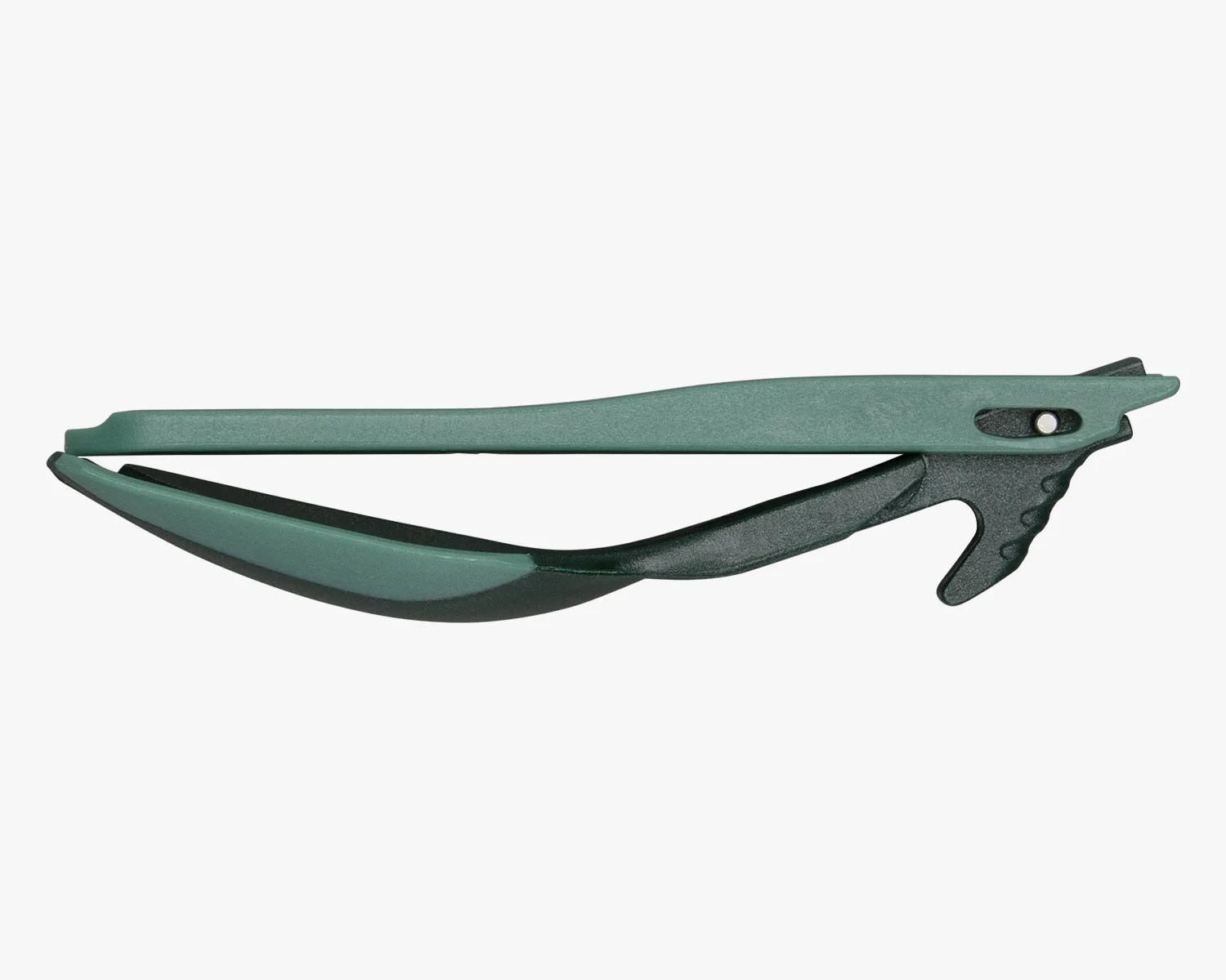 Green and black plastic hair clip with a curved design and a locking mechanism.