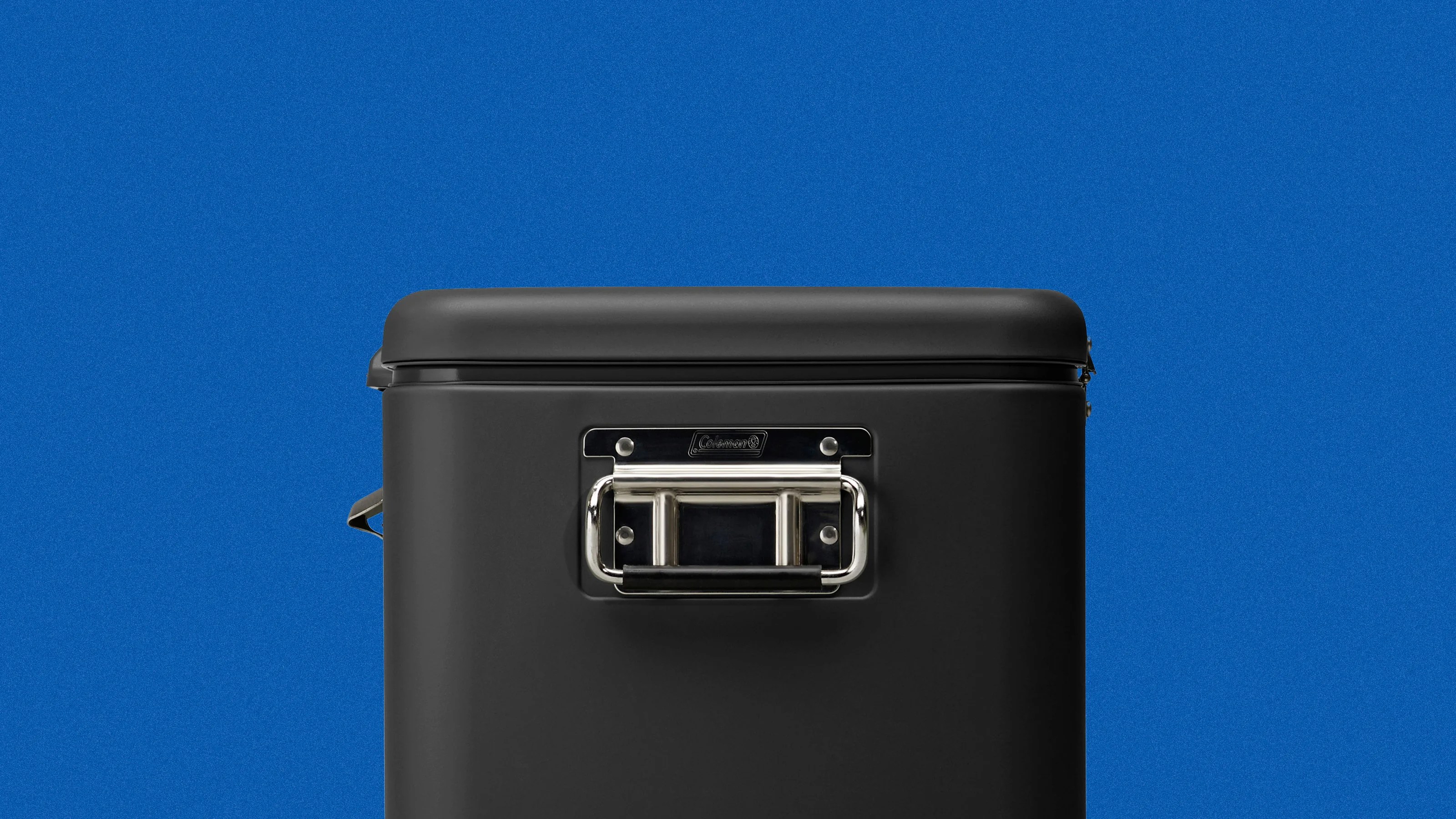 Black hard-shell suitcase with a silver metal handle against a blue background.