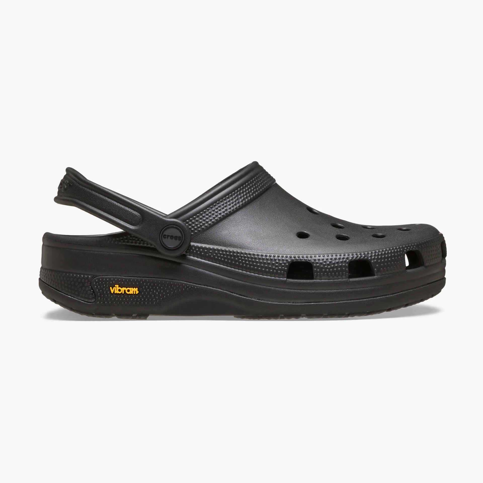 Black Crocs clog with heel strap and Vibram sole, side view on a white background.