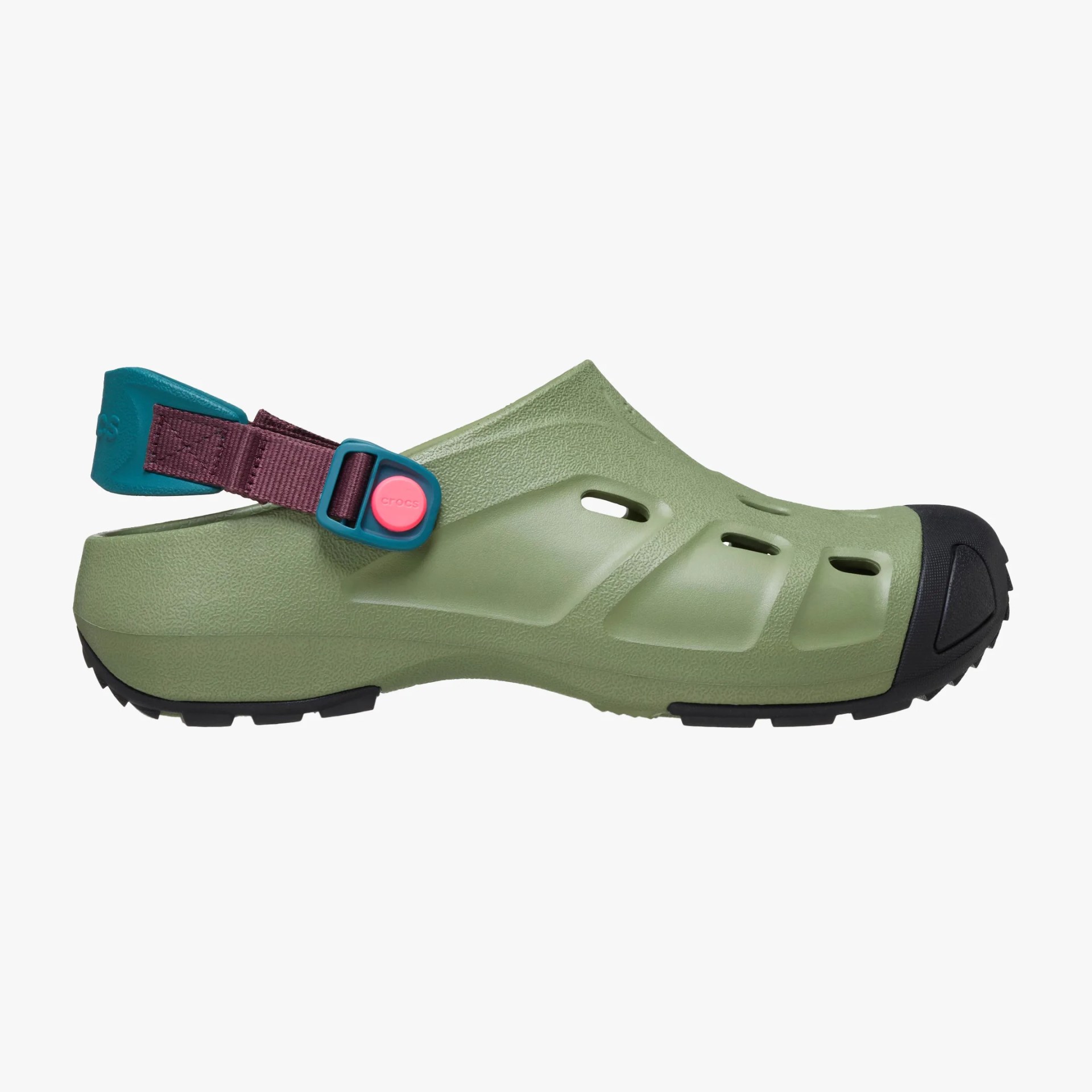 Olive green Crocs clog with black toe cap and adjustable maroon strap with teal and pink button.