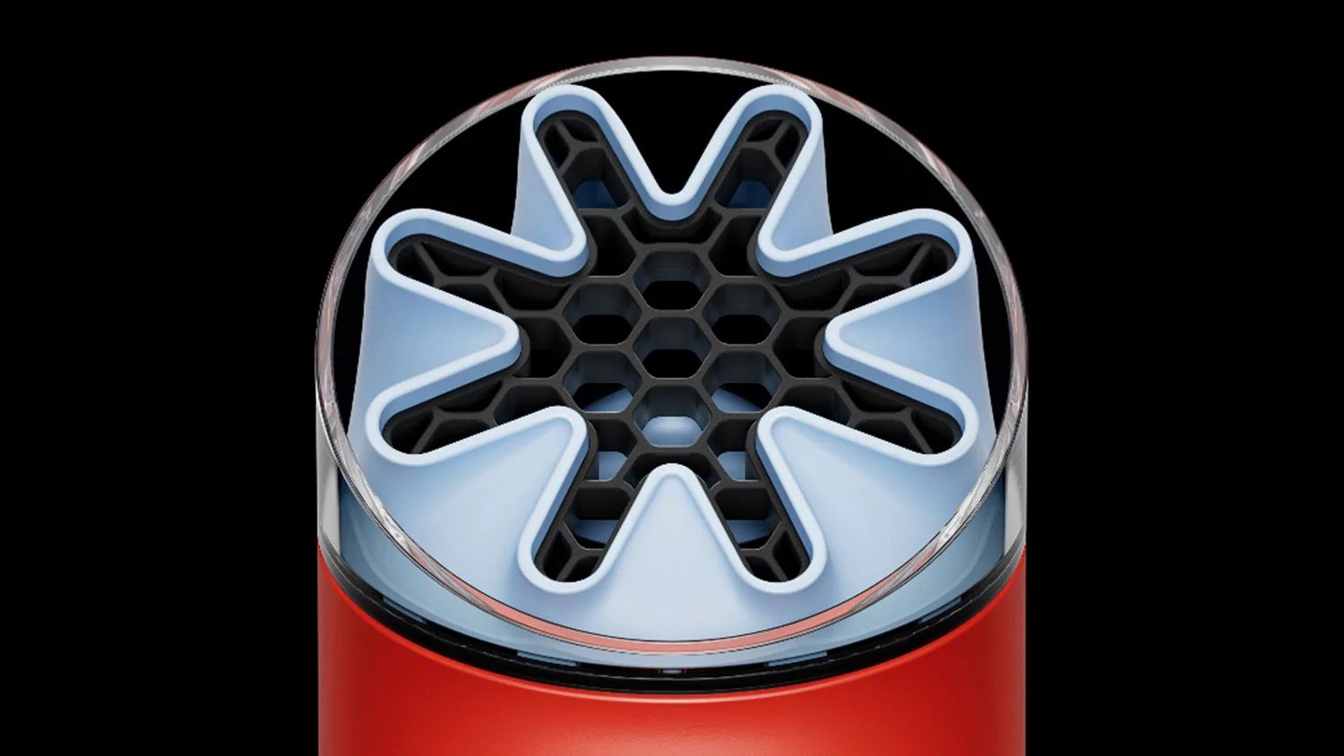 Close-up of a red cylindrical device with a blue star-shaped silicone opening and a black honeycomb grid inside.