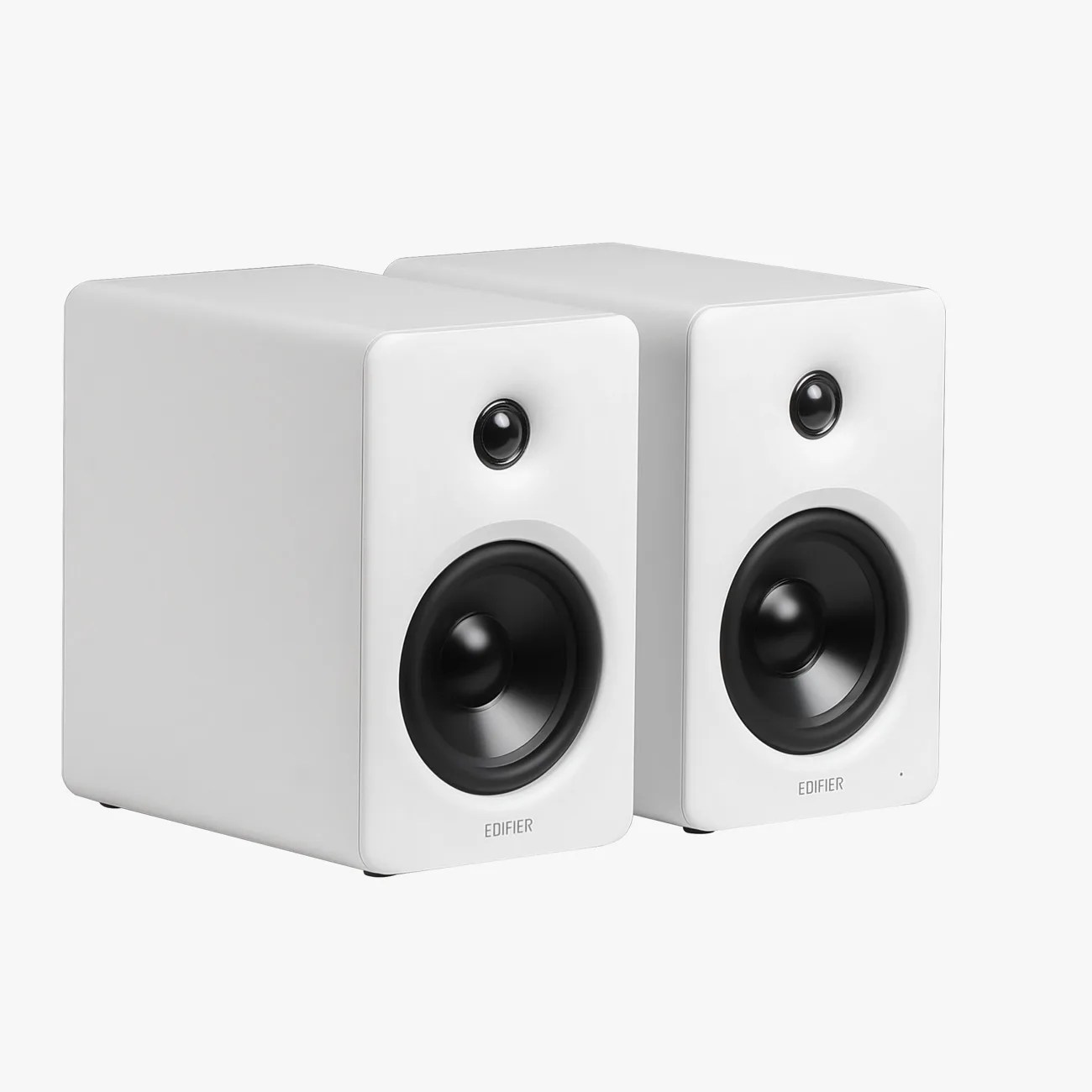 Pair of white Edifier bookshelf speakers with black drivers and rounded edges.