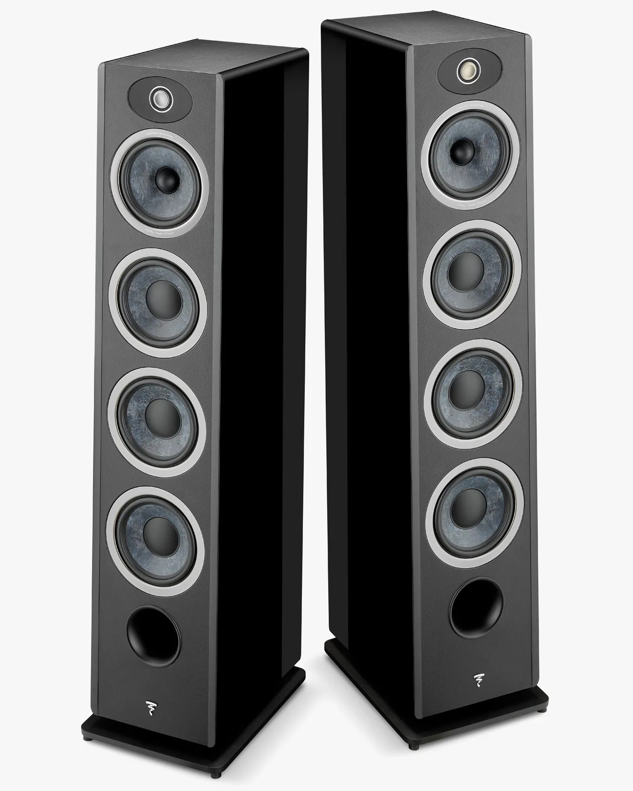 Pair of tall black floor-standing speakers with four circular drivers and a port at the bottom.