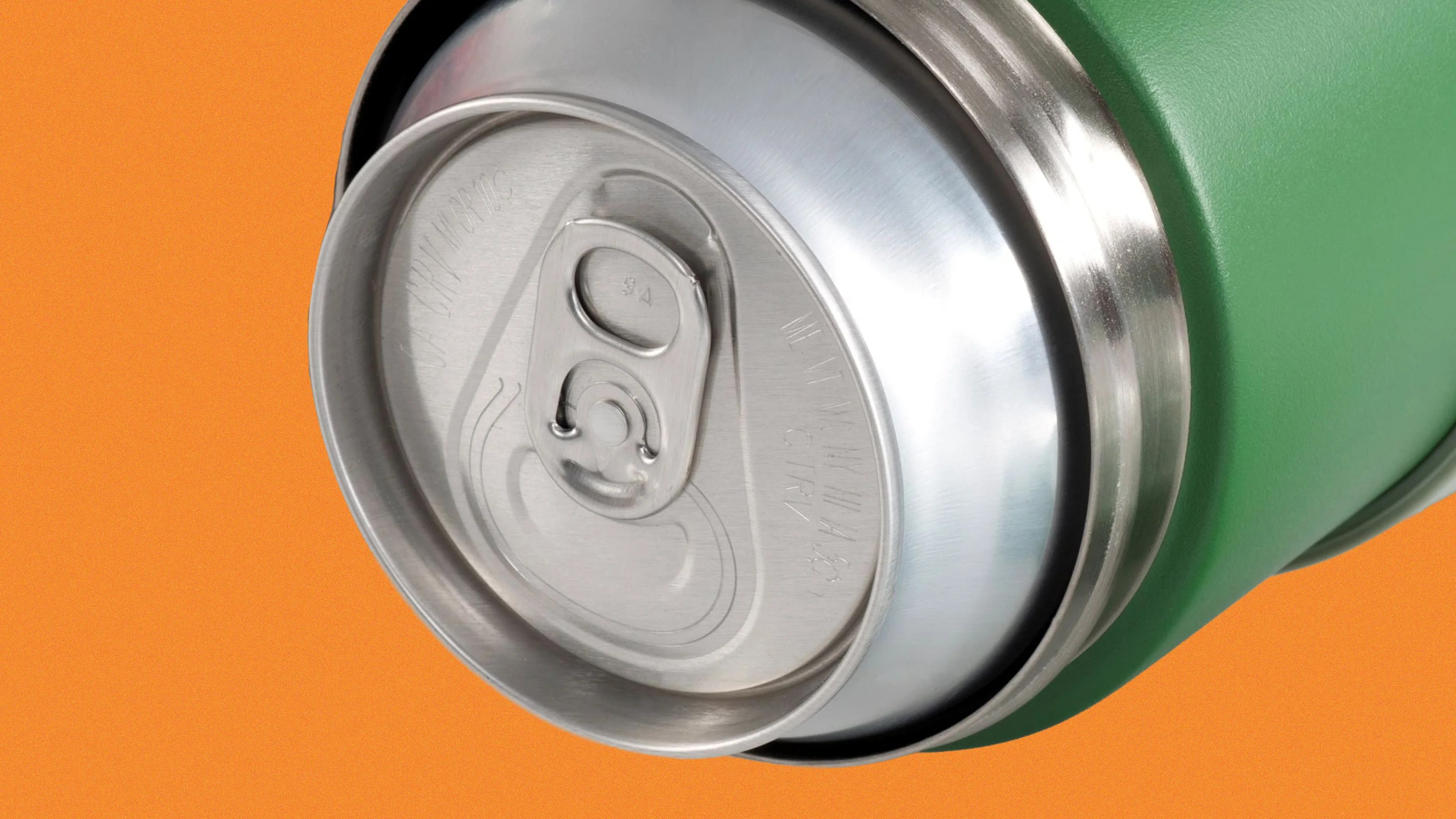 Close-up of a silver aluminum can top inside a green insulated holder against an orange background.