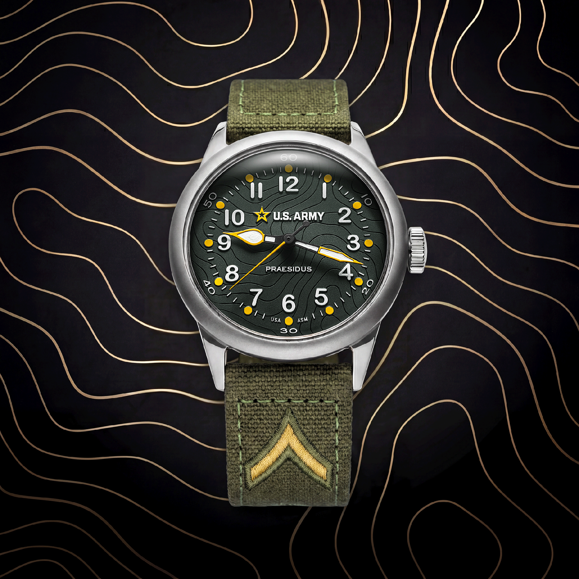 Military-style wristwatch with green textured dial, yellow accents, and olive fabric strap with embroidered chevron.
