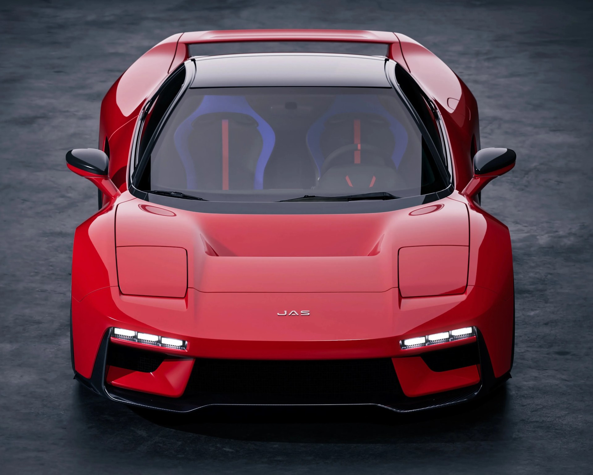 Red sports car front with black roof, blue racing seats, and JAS logo on the hood.