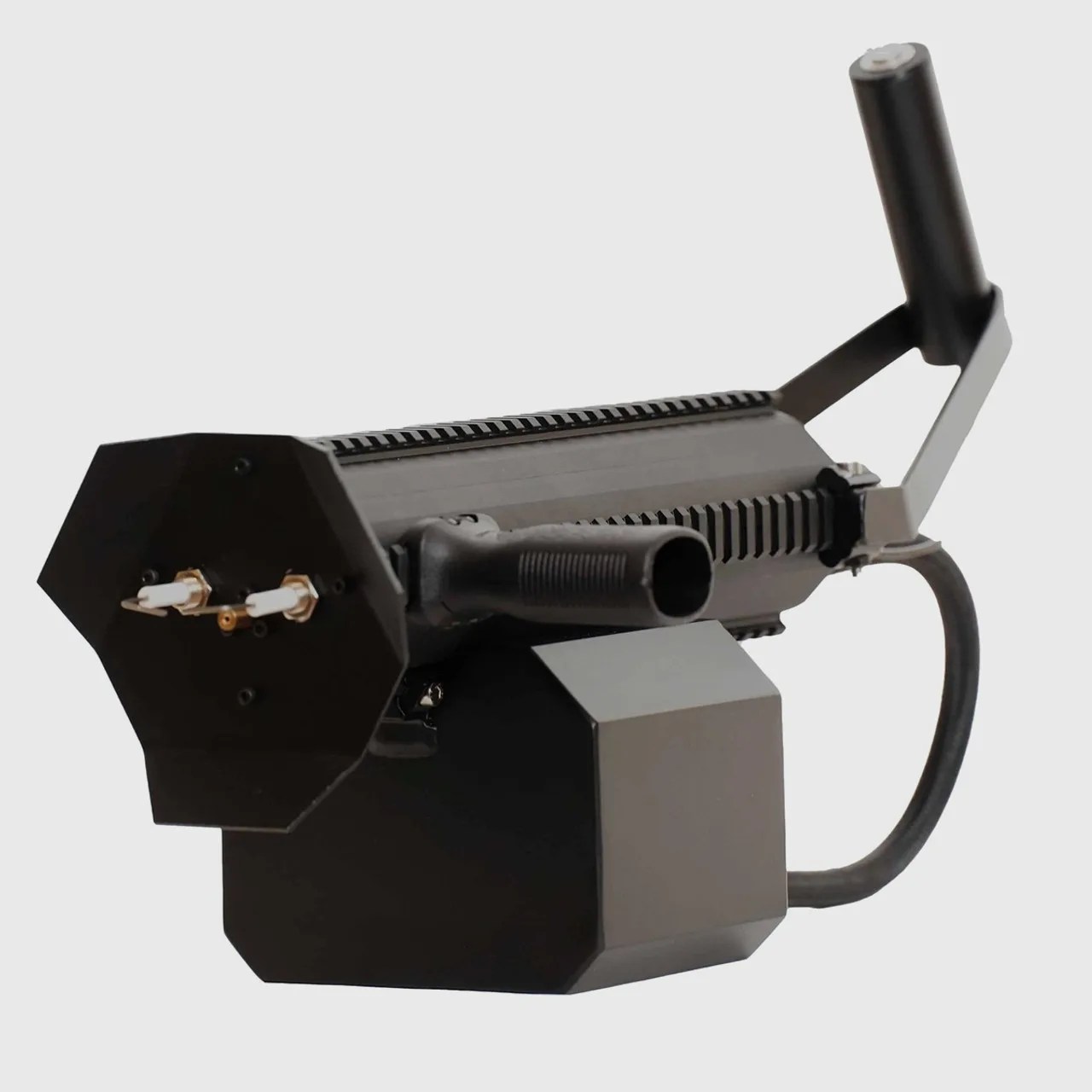 Black hexagonal-shaped fog machine with a handle and two white nozzles on the front.