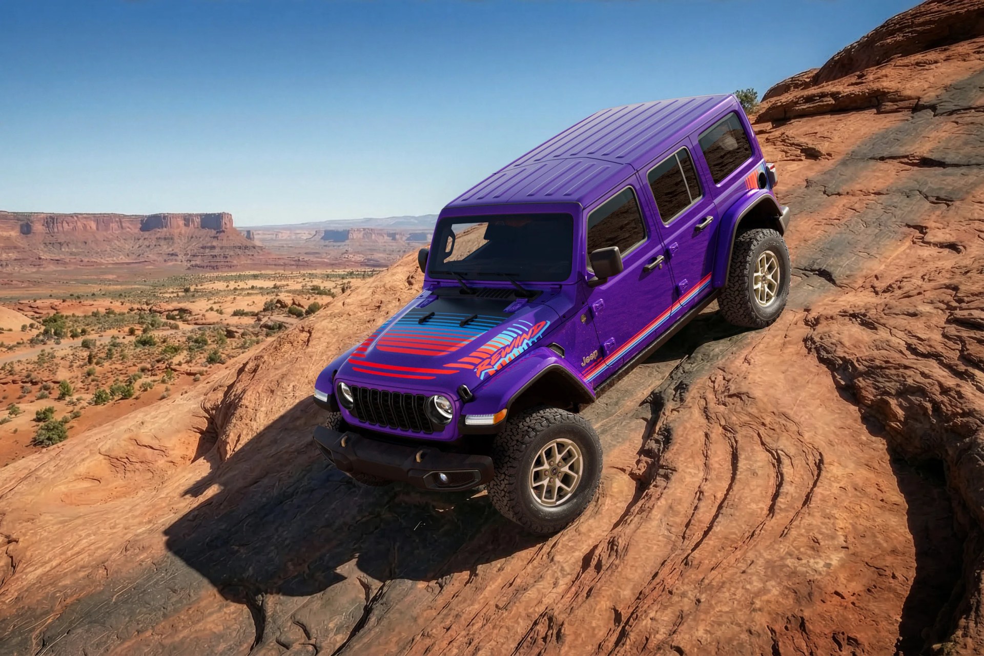 Purple Jeep Wrangler with red and blue stripes driving on rocky desert terrain.