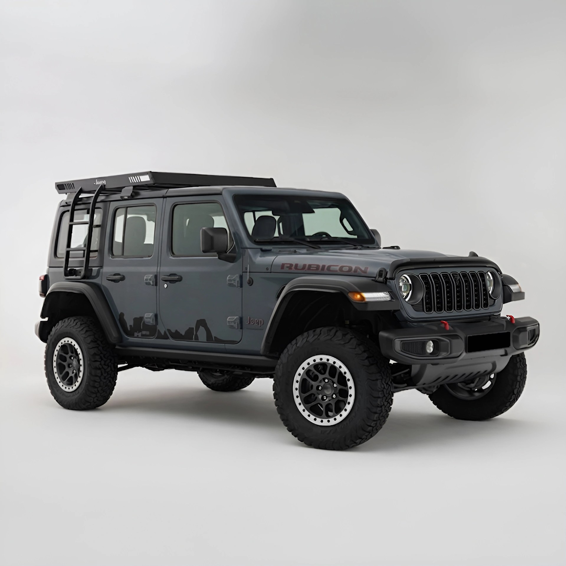 Gray Jeep Rubicon with roof rack and ladder on a white background.