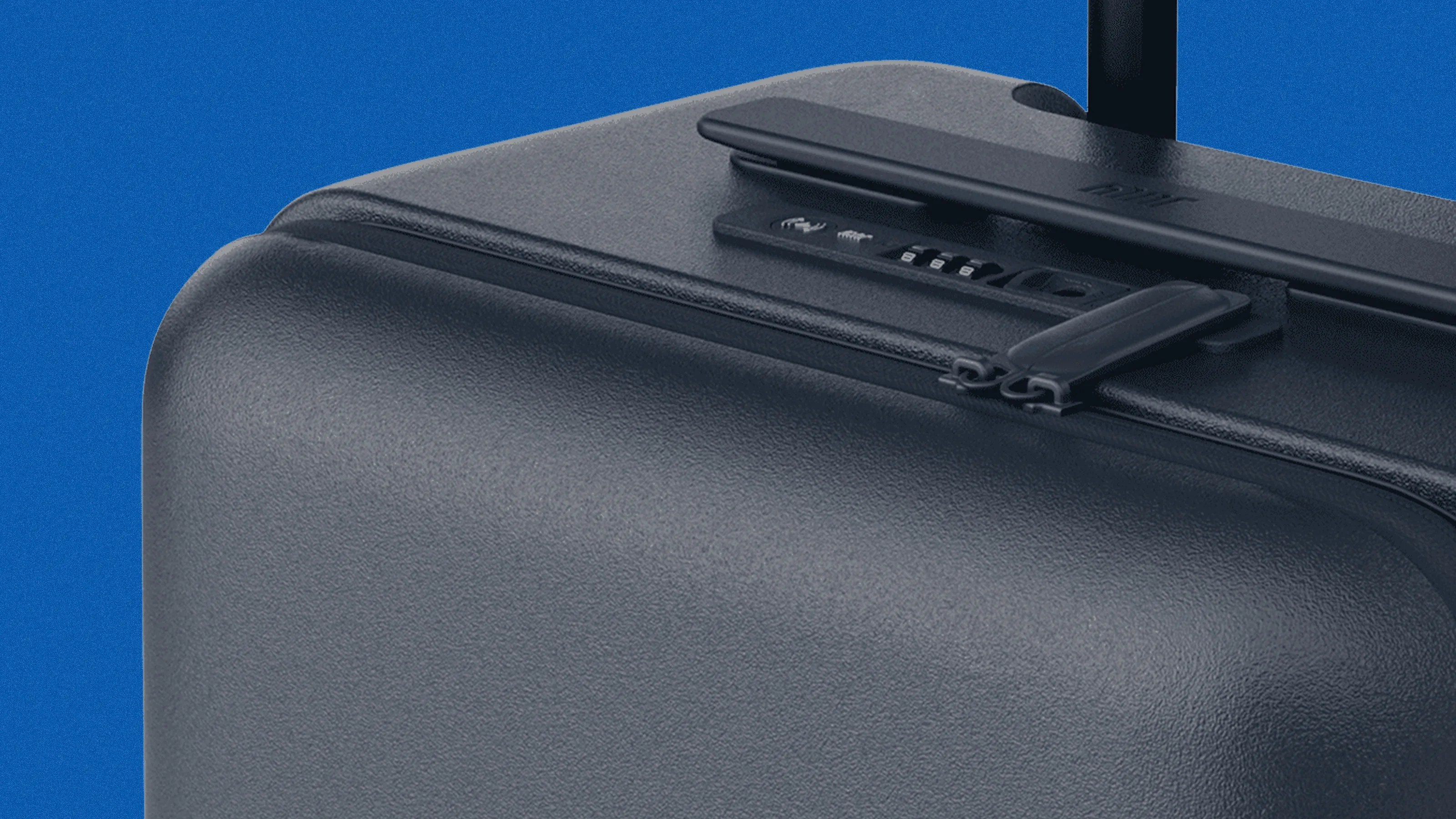 Close-up of a black hard-shell suitcase corner with a zipper and built-in combination lock against a blue background.