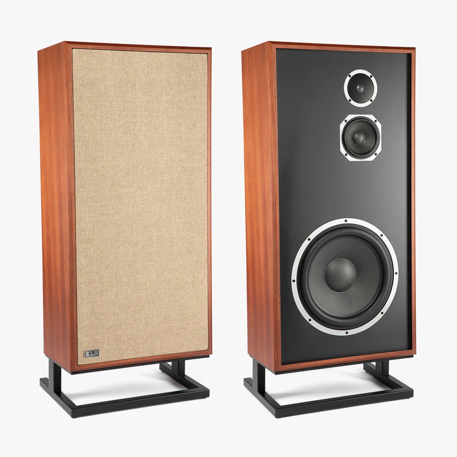 Pair of vintage-style wooden floor-standing speakers with black front panel and beige fabric grille on black metal stands.
