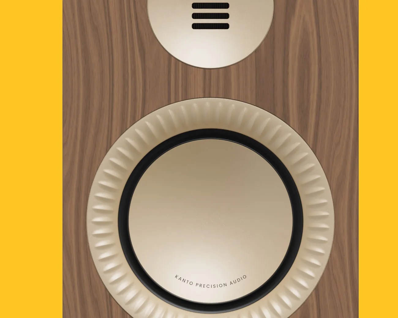 Close-up of a wooden speaker with a beige circular driver labeled "Kanto Precision Audio.