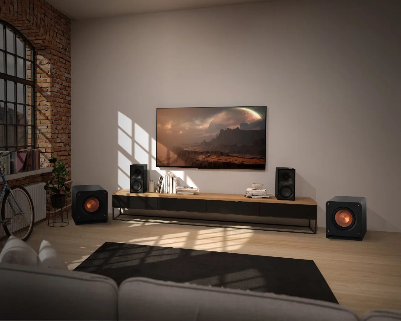 Modern living room with a wall-mounted flat-screen TV, black and copper subwoofers, and a wooden media console.