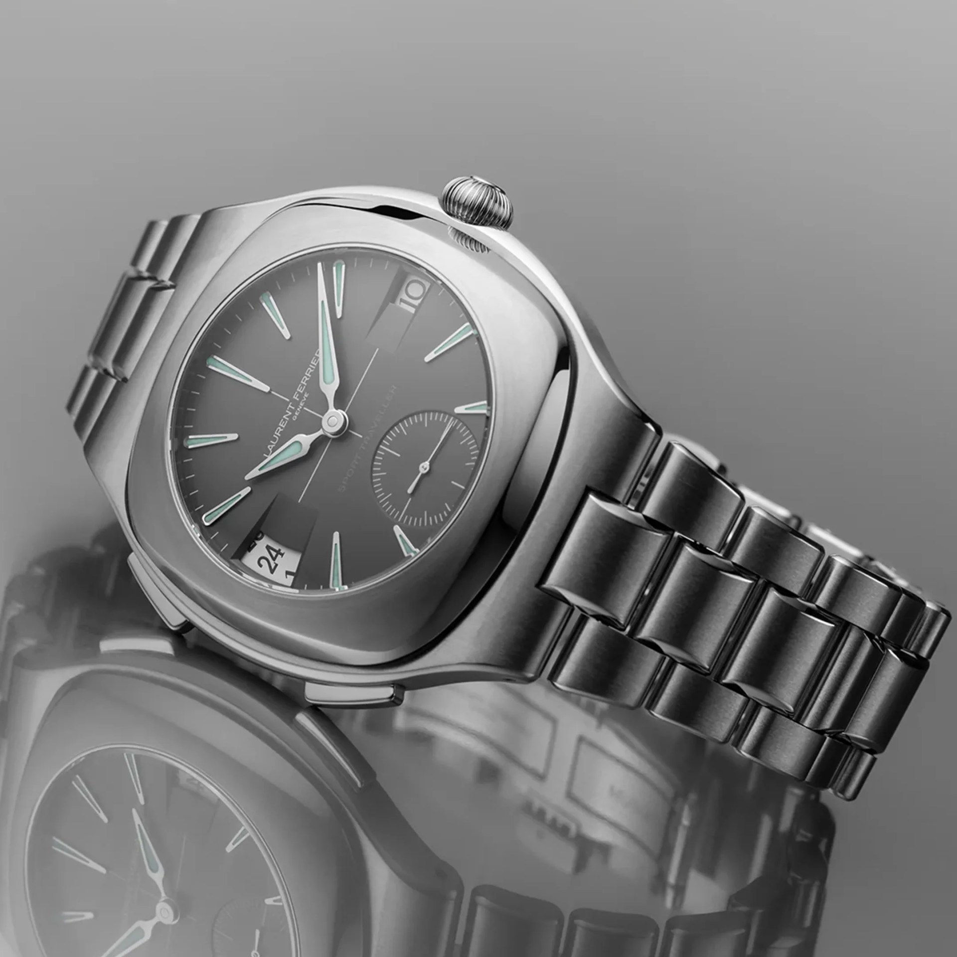 Close-up of a silver metal wristwatch with a black dial, luminous hands, and a date window, reflected on a glossy surface.