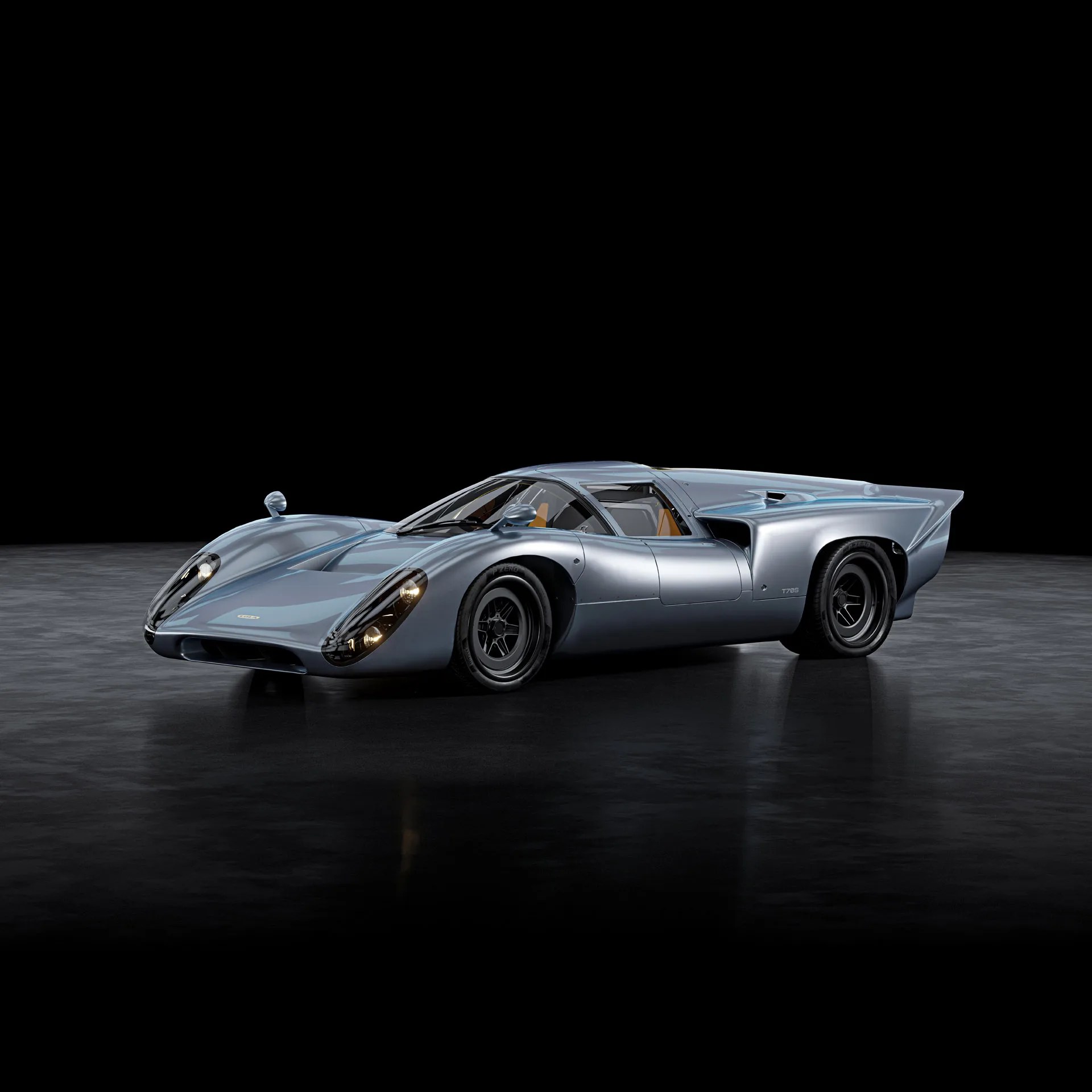 Sleek silver-blue vintage race car with aerodynamic curves and black wheels on a dark reflective floor.