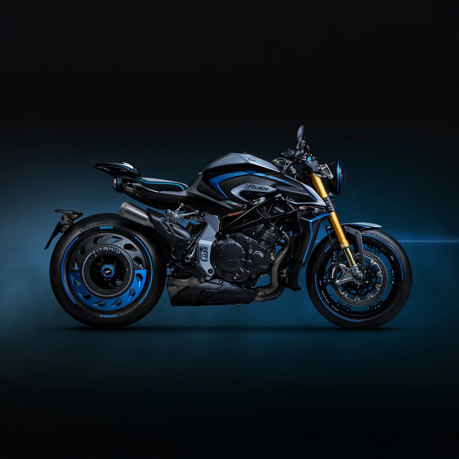 Black and blue MV Agusta Rush motorcycle with gold front forks on a dark gradient background.