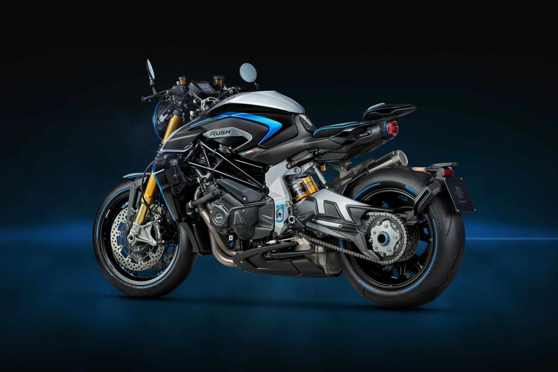 Black and silver sport motorcycle with blue accents and gold front forks on a dark blue background.