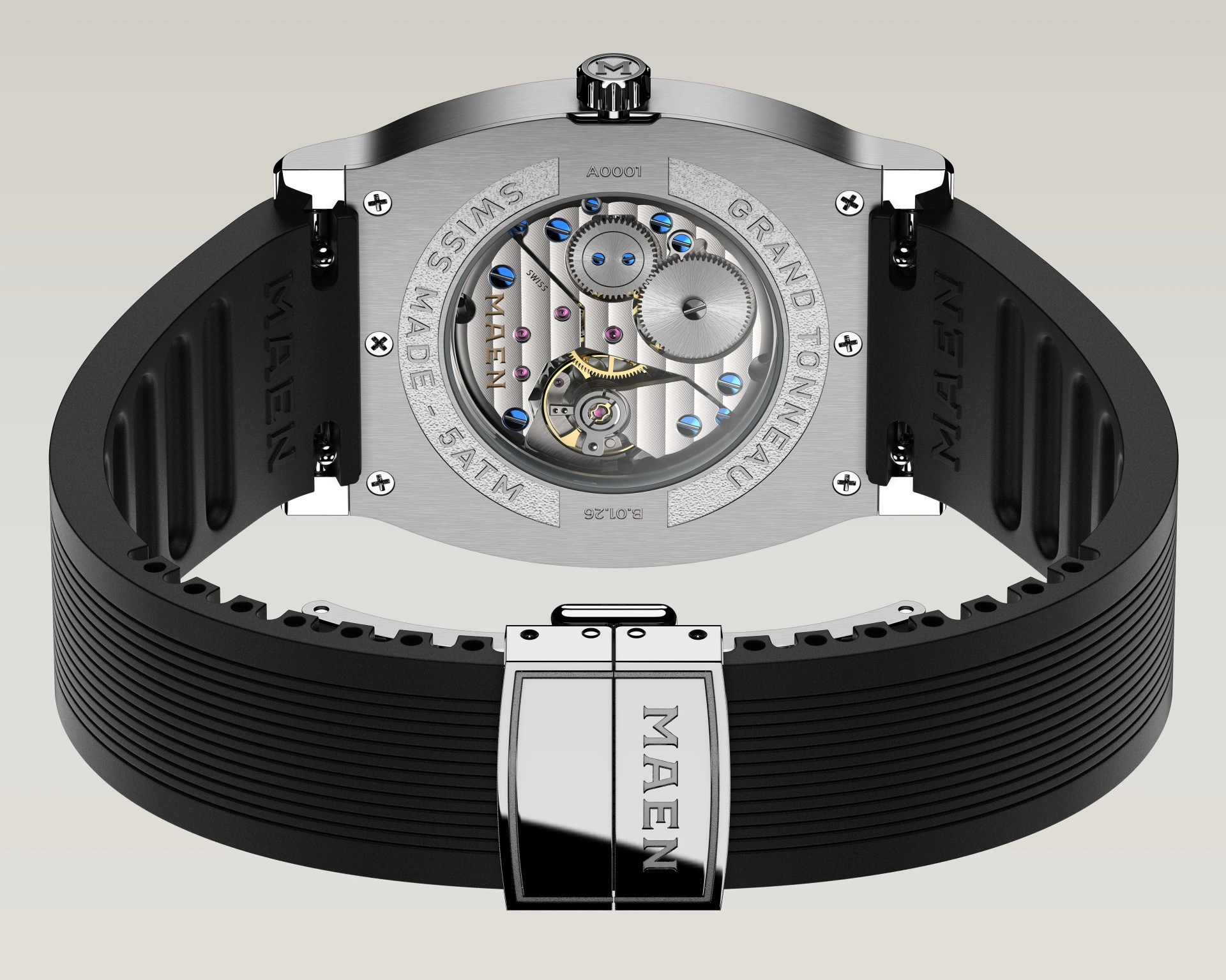 Back view of a Maen Grand Tonneau wristwatch with a black ribbed rubber strap and visible mechanical movement through a transparent case back.