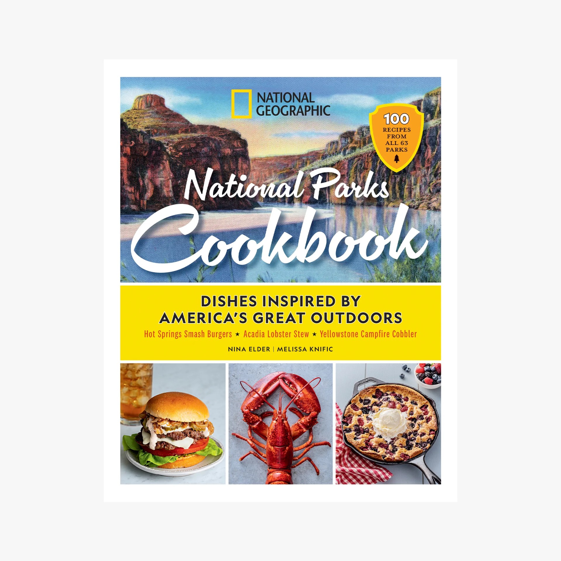 Cover of National Geographic National Parks Cookbook featuring a scenic canyon, a burger, a lobster, and a berry cobbler with ice cream.