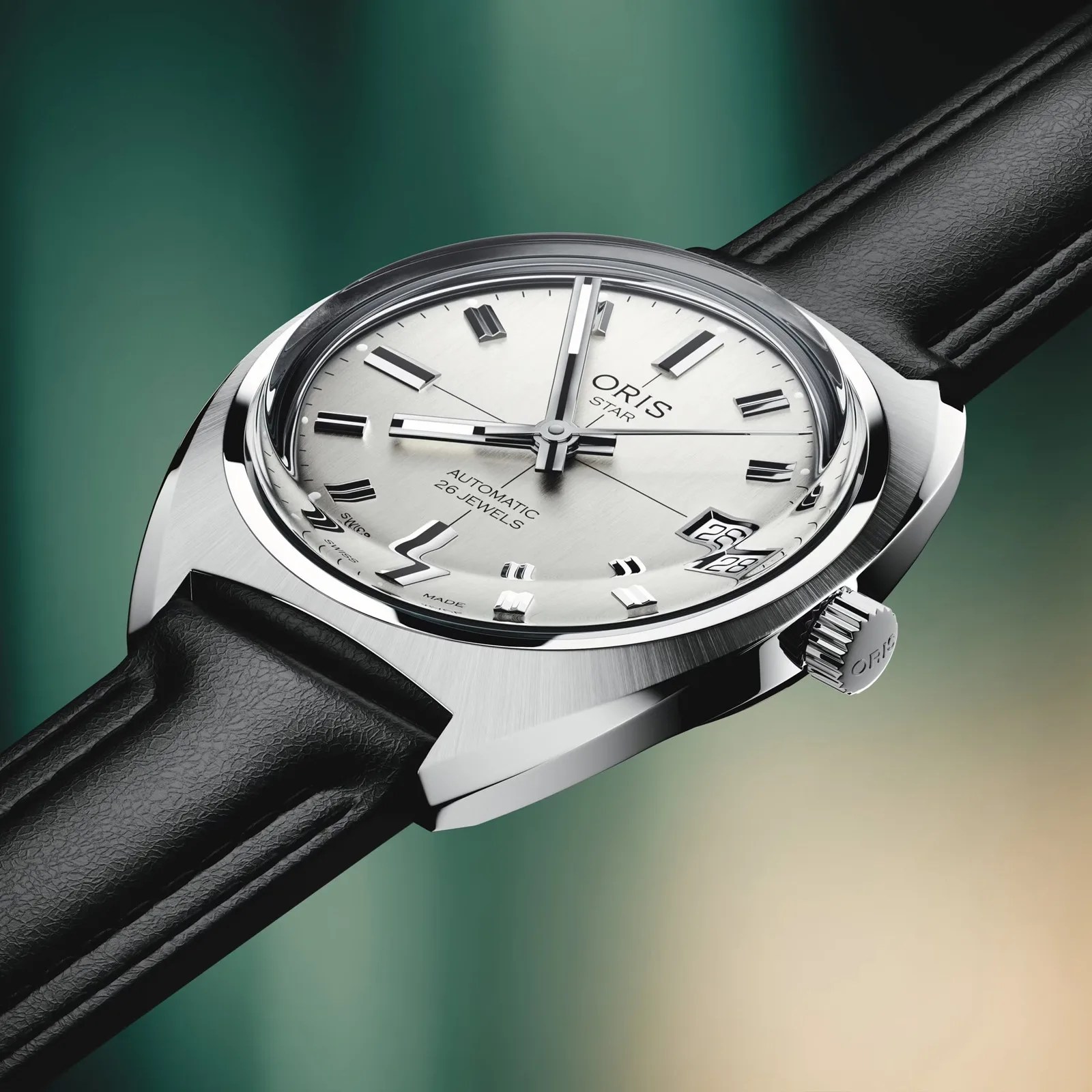 Silver Oris Star automatic wristwatch with black leather strap and date display at 3 o'clock.