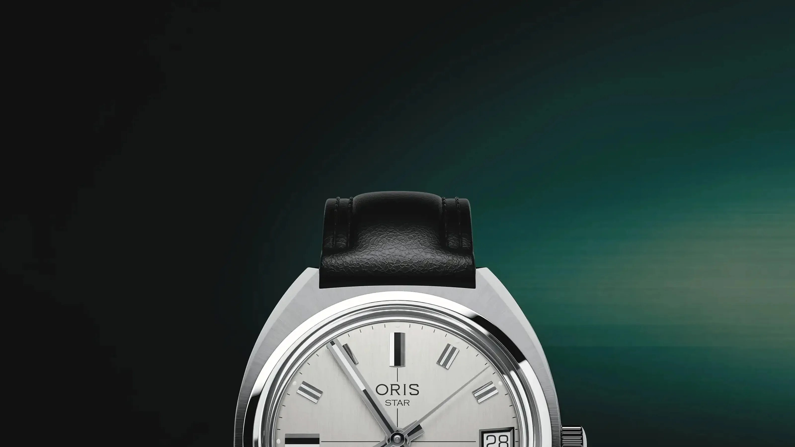 Silver Oris Star wristwatch with black leather strap and date display on a gradient dark green background.