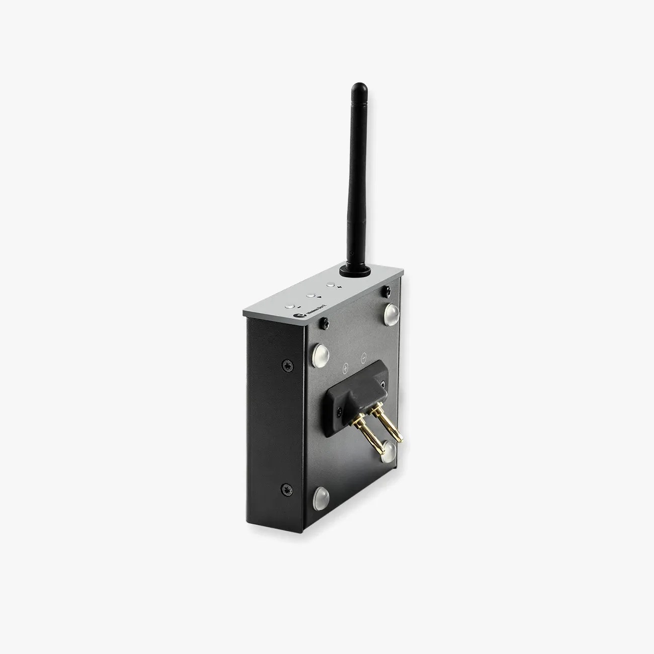 Black and silver wireless audio transmitter with antenna and gold-plated connectors on a white background.