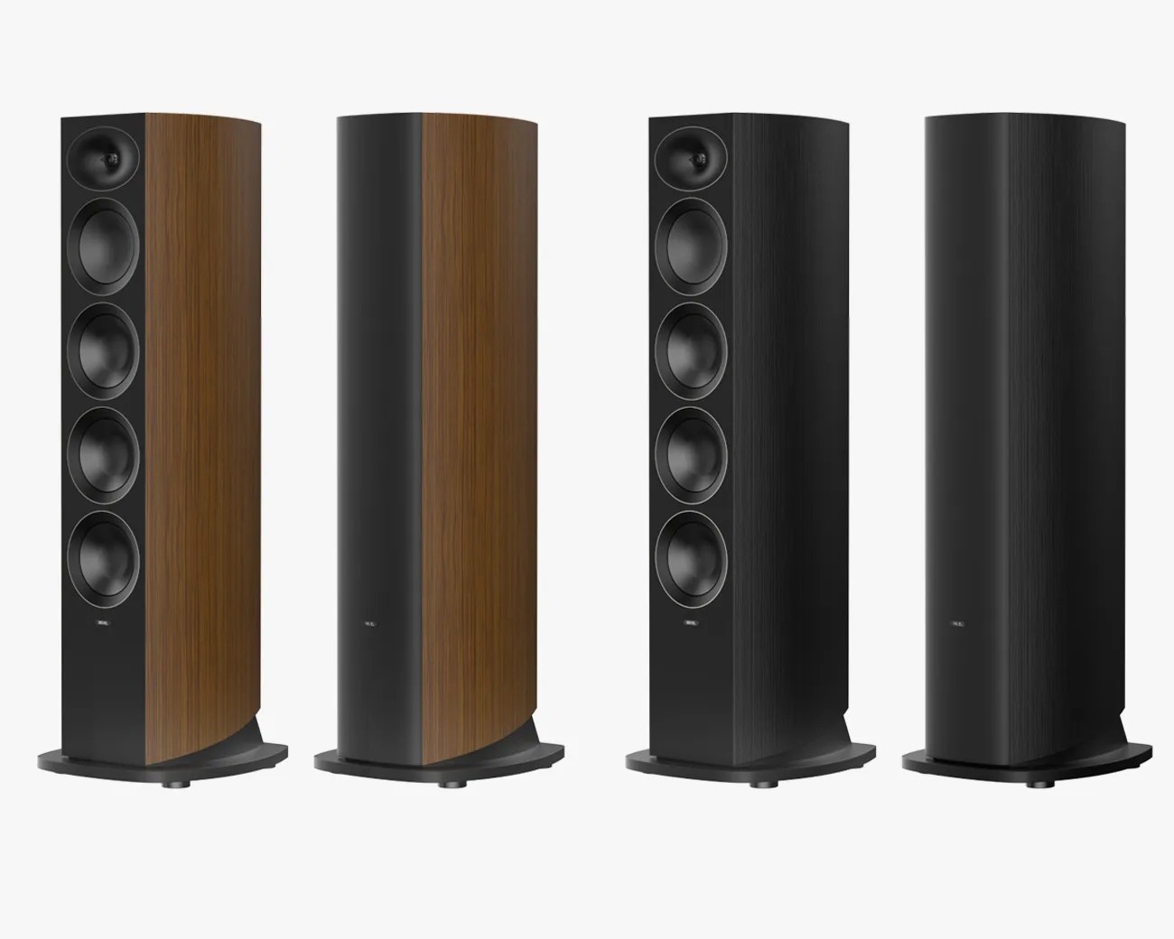 Four tall floor-standing speakers, two with wood grain sides and two with black sides, each with four visible drivers on the front.