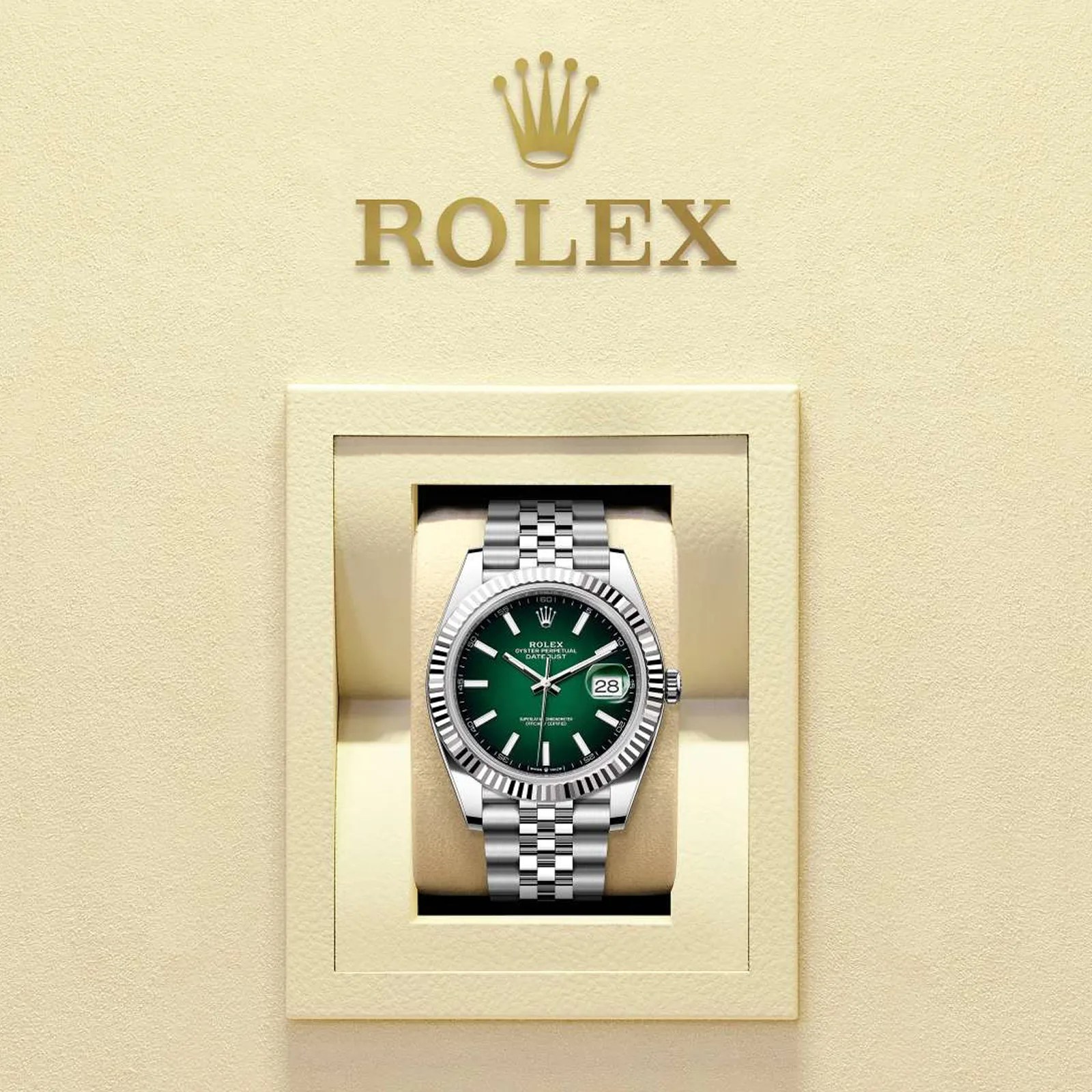 Rolex Oyster Perpetual Datejust watch with green dial and silver jubilee bracelet in a beige display case.