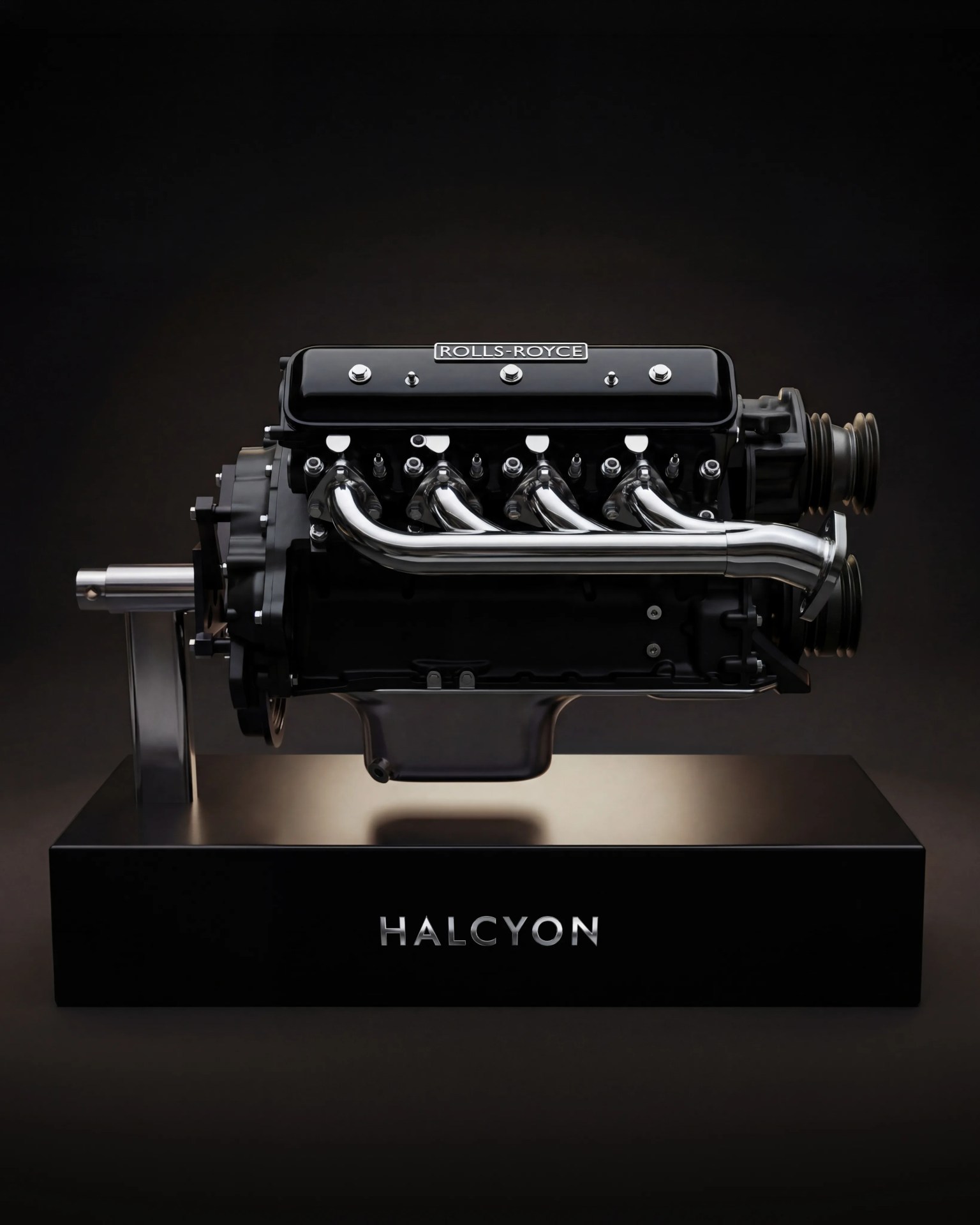 Black and chrome Rolls-Royce engine displayed on a black stand with "HALCYON" branding.