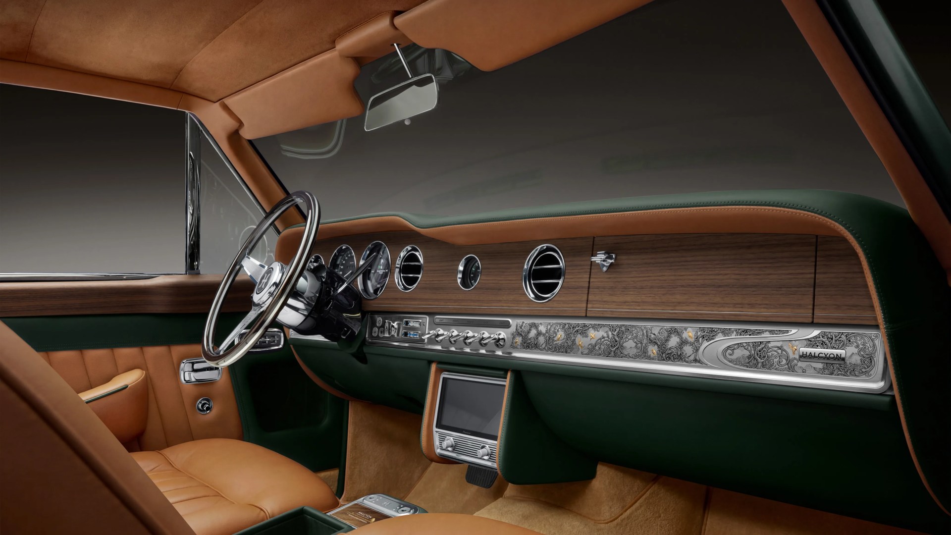 Car interior with tan leather seats, green and wood-trimmed dashboard featuring chrome accents and a central touchscreen.