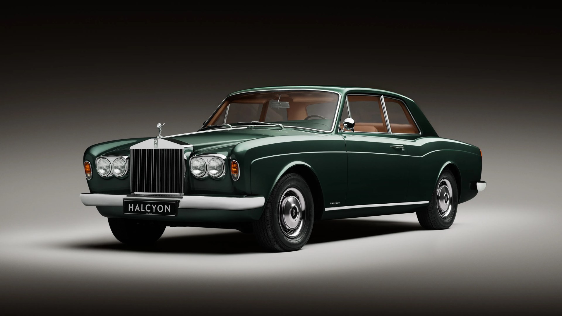 Dark green classic Rolls-Royce Halcyon coupe with chrome grille and tan leather interior on a gradient background.
