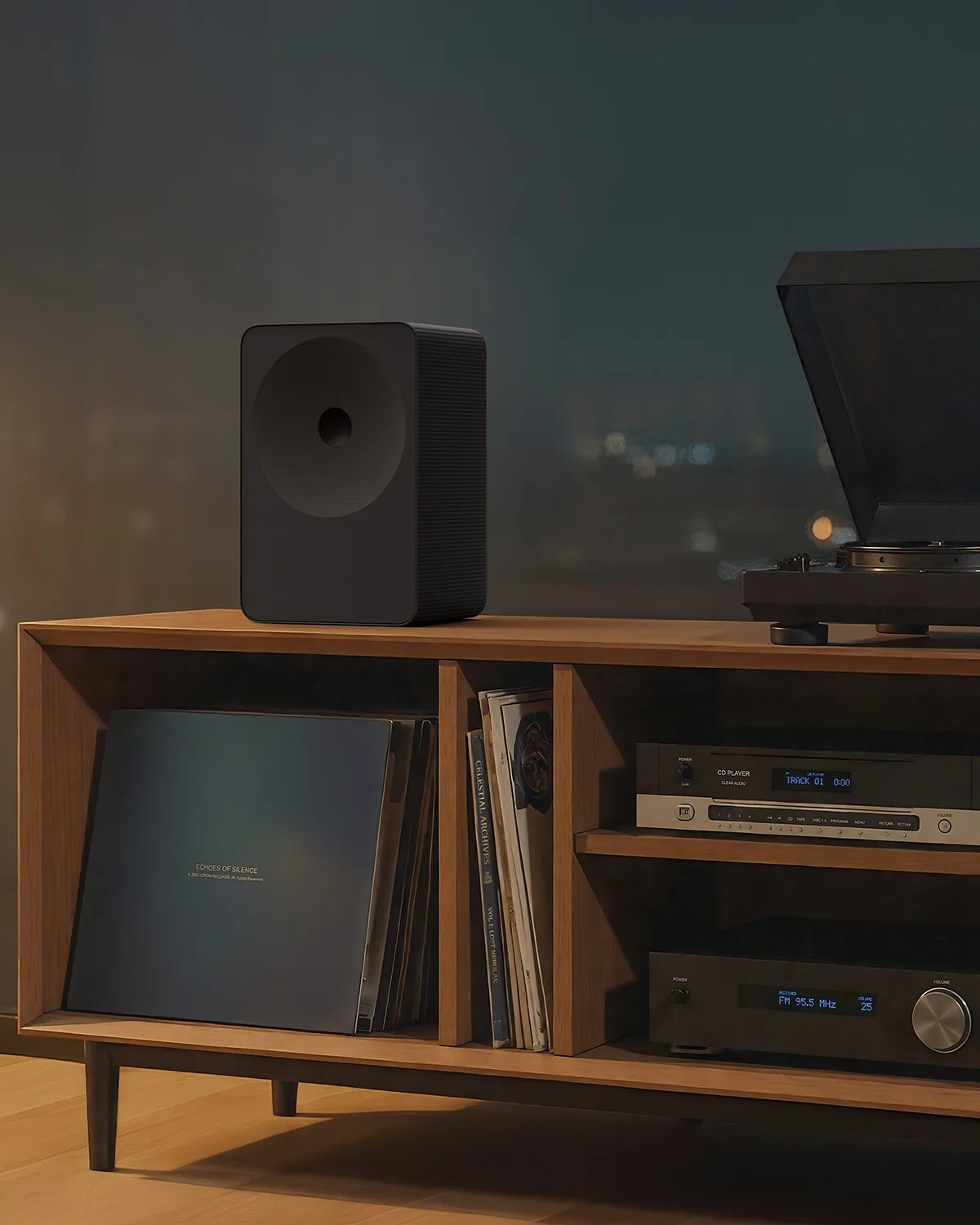 Black rectangular speaker with rounded edges on a wooden media console holding vinyl records and audio equipment.