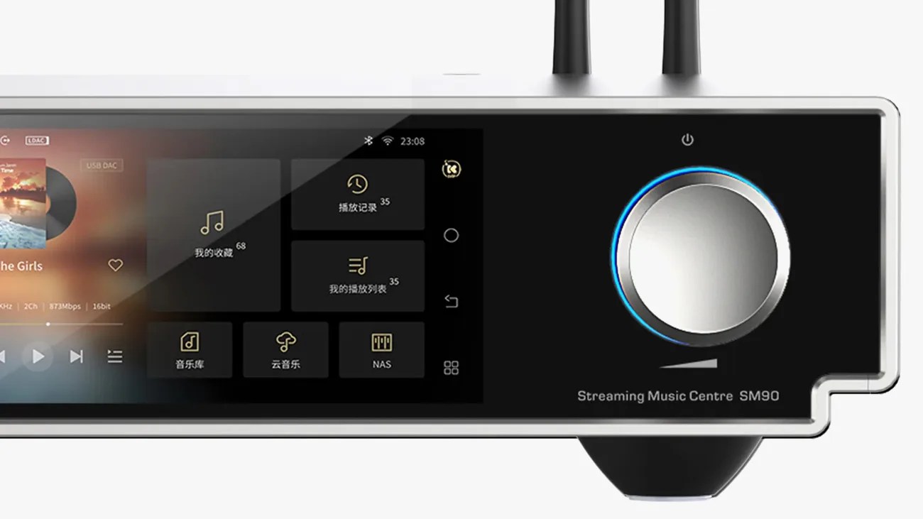 Close-up of a streaming music center SM90 with a touchscreen interface and a large silver volume knob with blue LED ring.
