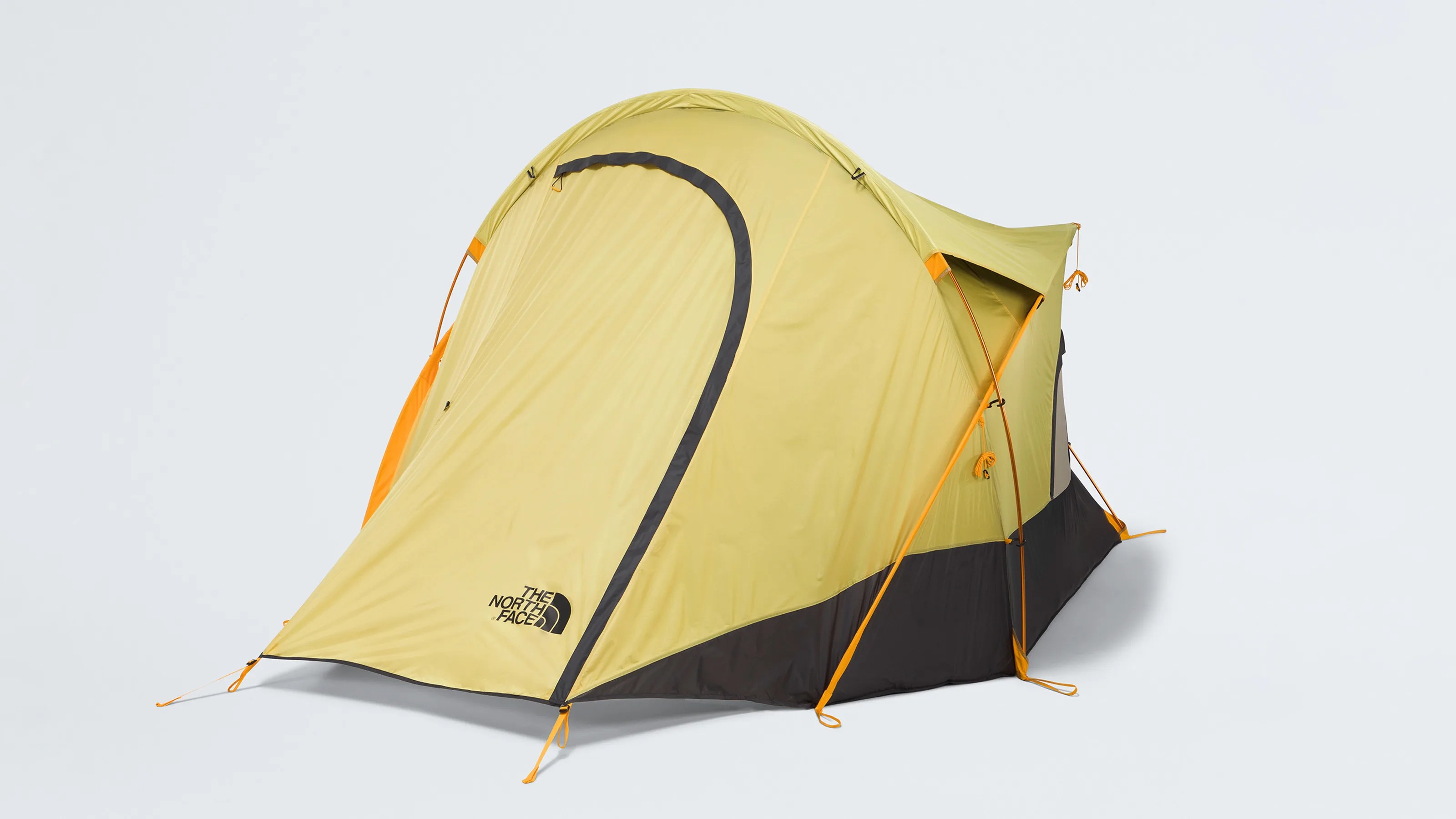 Yellow and black dome tent with orange poles and The North Face logo on the front.
