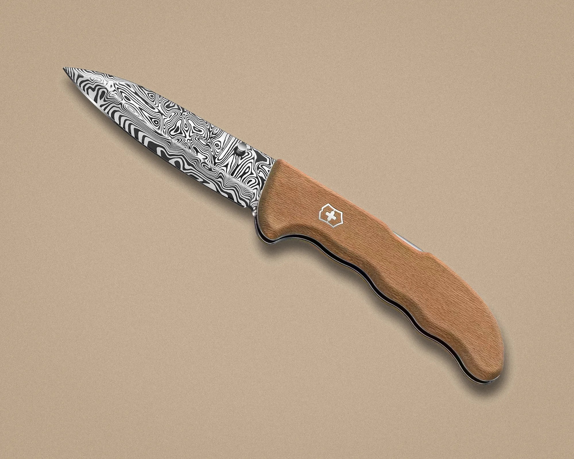 Folding knife with a patterned Damascus steel blade and a wooden handle featuring a white cross emblem.